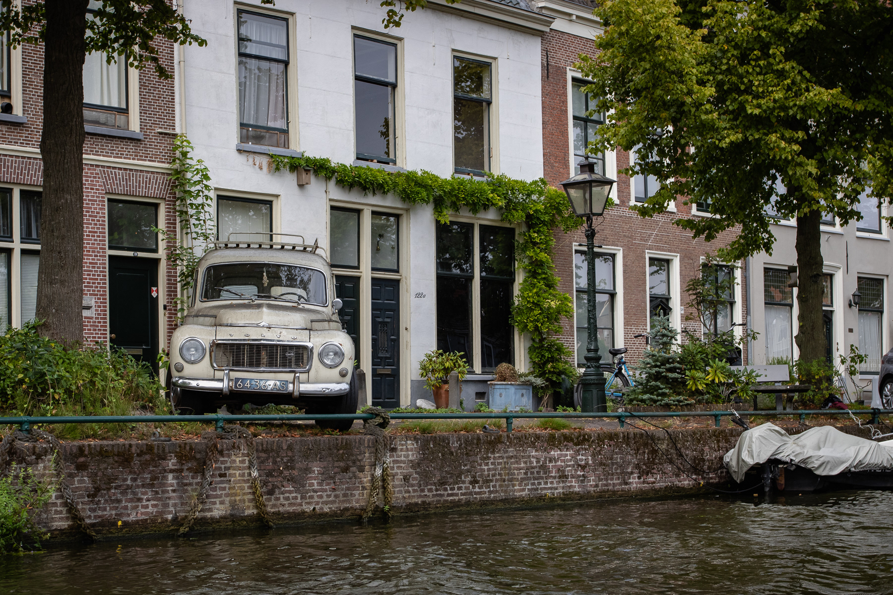Old Volvo car parked at a canal in Leiden