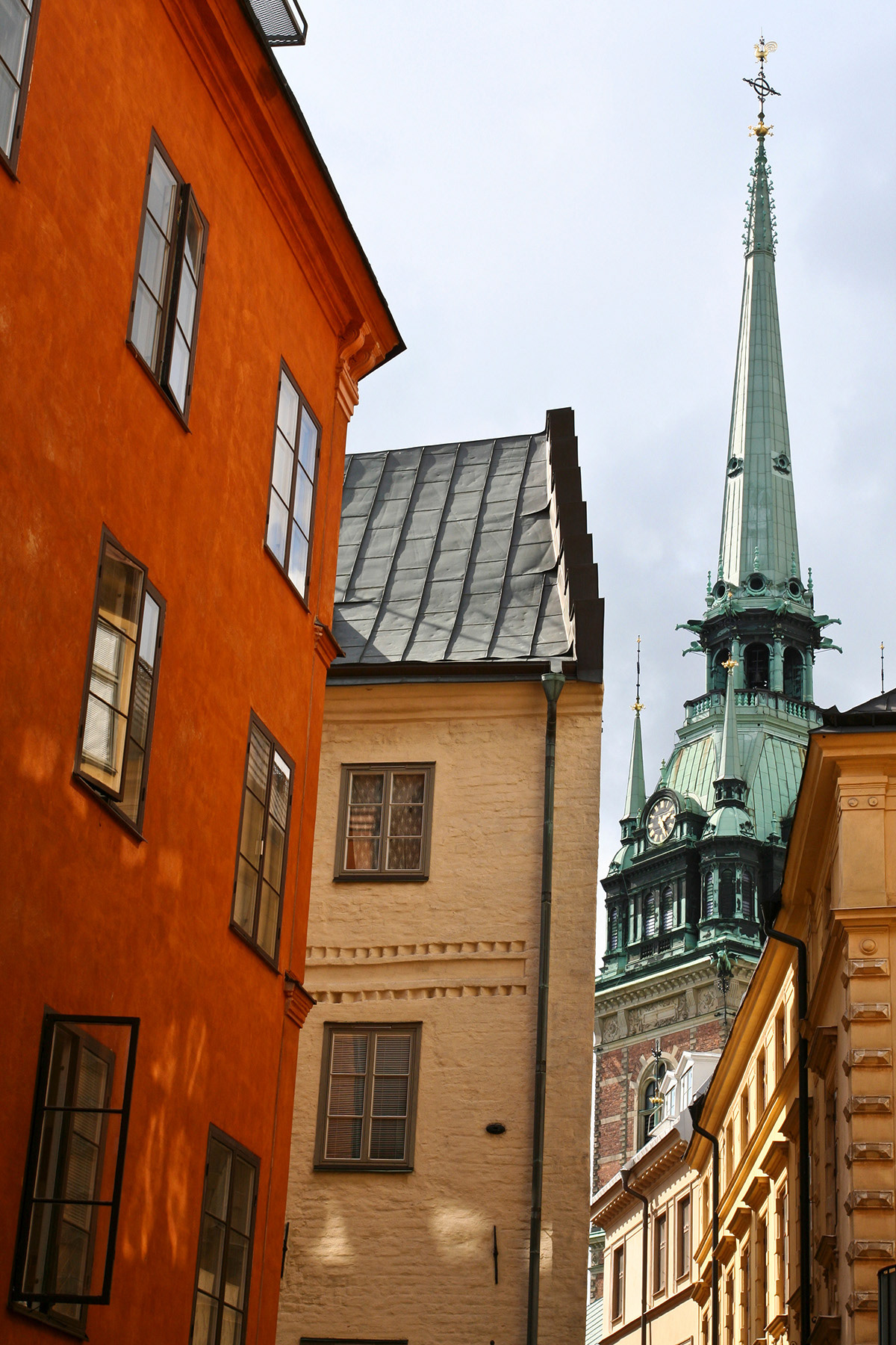 The German church (Tyska Kyrkan) peaks through the facades of the Stockholm Old Town, Summer 2006.