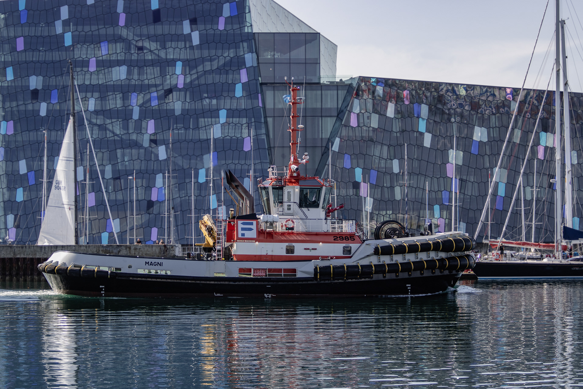 Tug boat Magni (2985) with the Harpa Concert Hall in the background