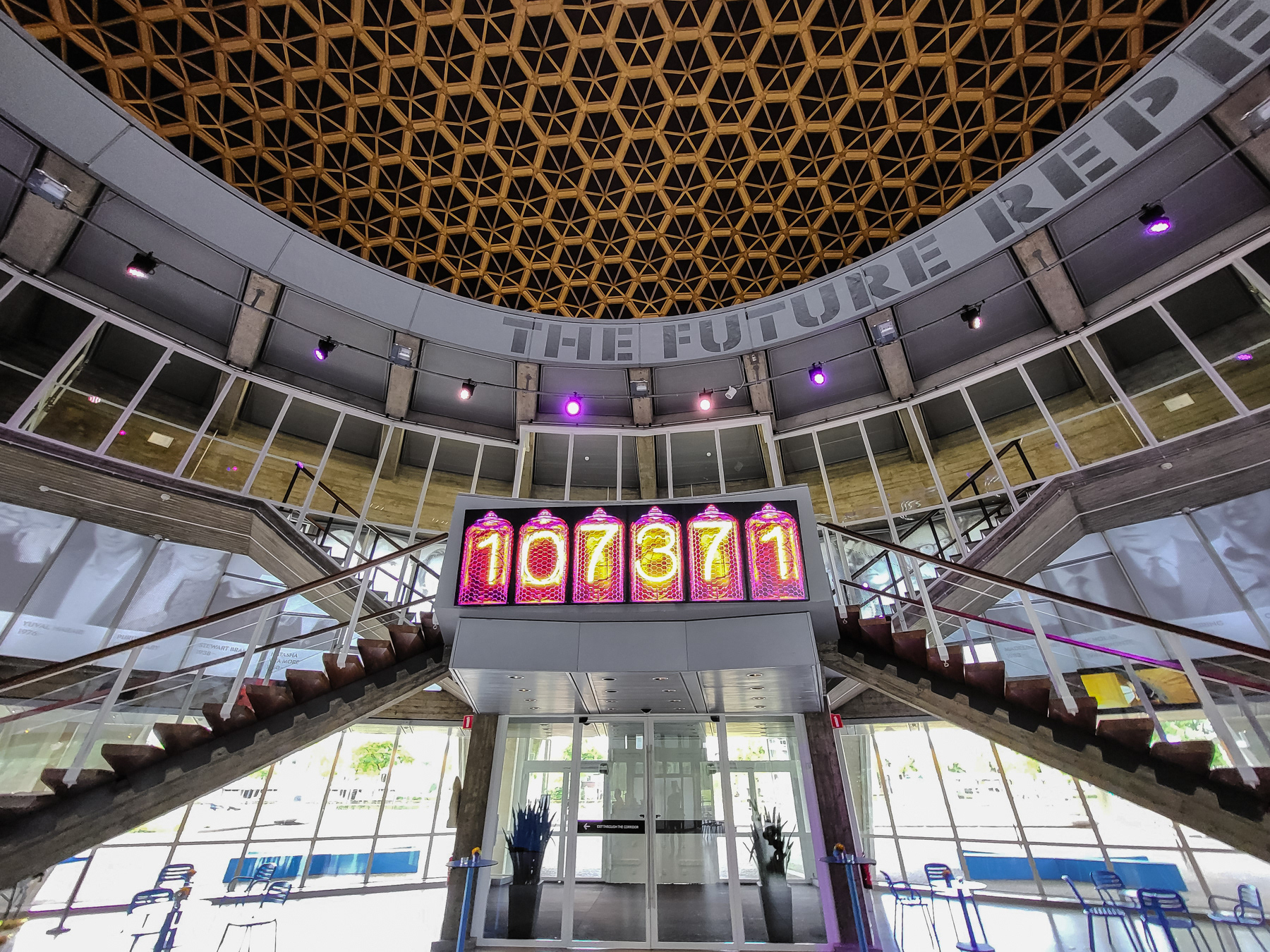 The entrance/exit of the Evoluon with a mysterious clock above it.