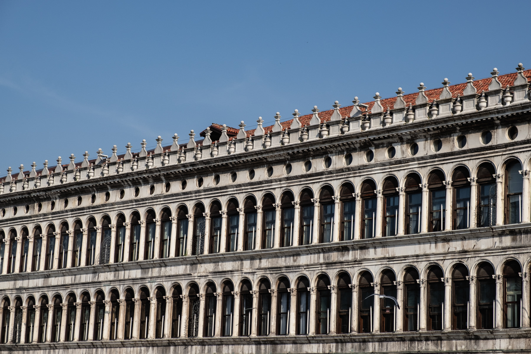 The arched facade of the San Marco buildings, July 2023.