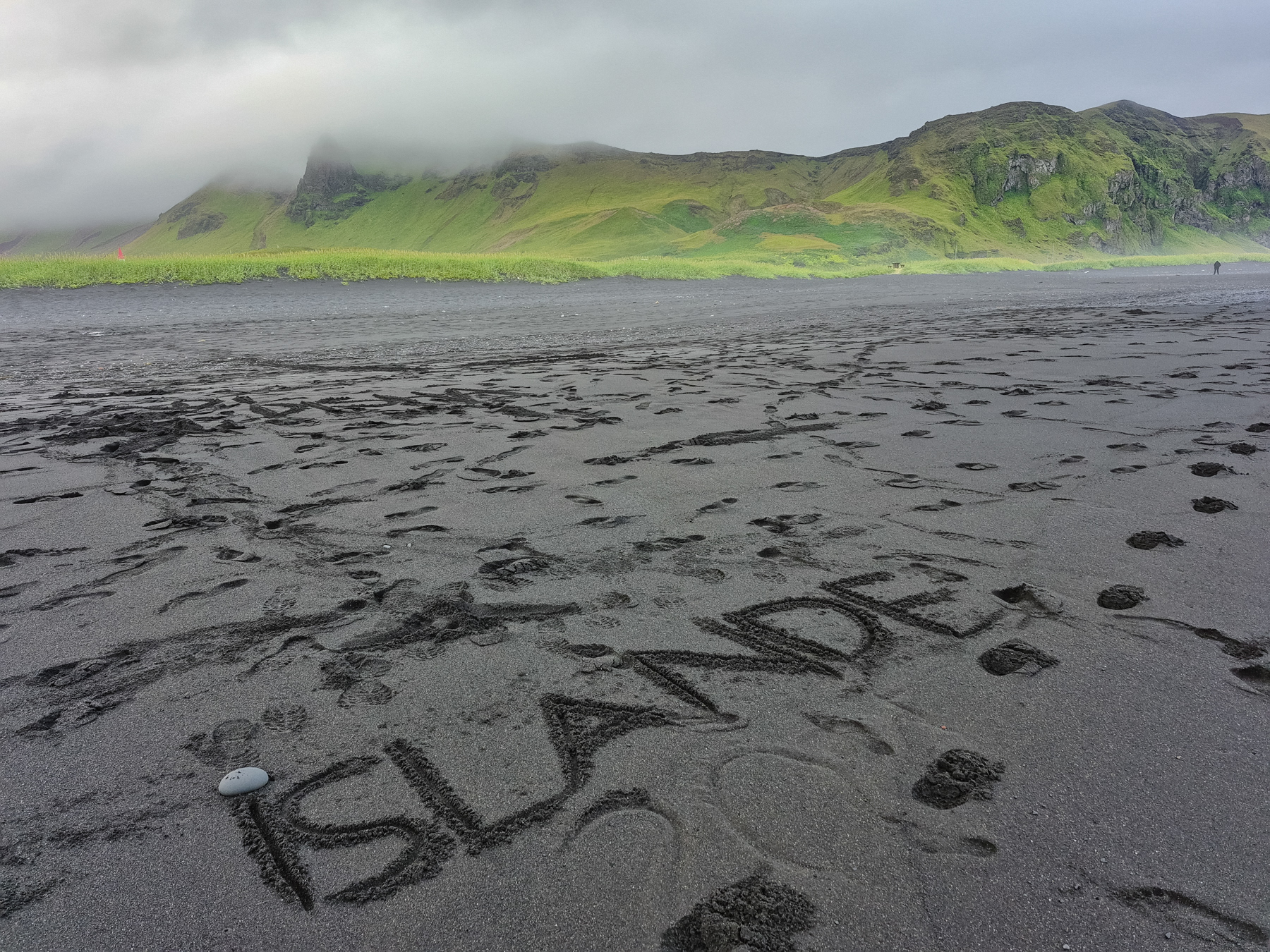 Islande "carved" into the sand of Víkurfjara Black Sand Beach in Vik, Iceland, July 2025.