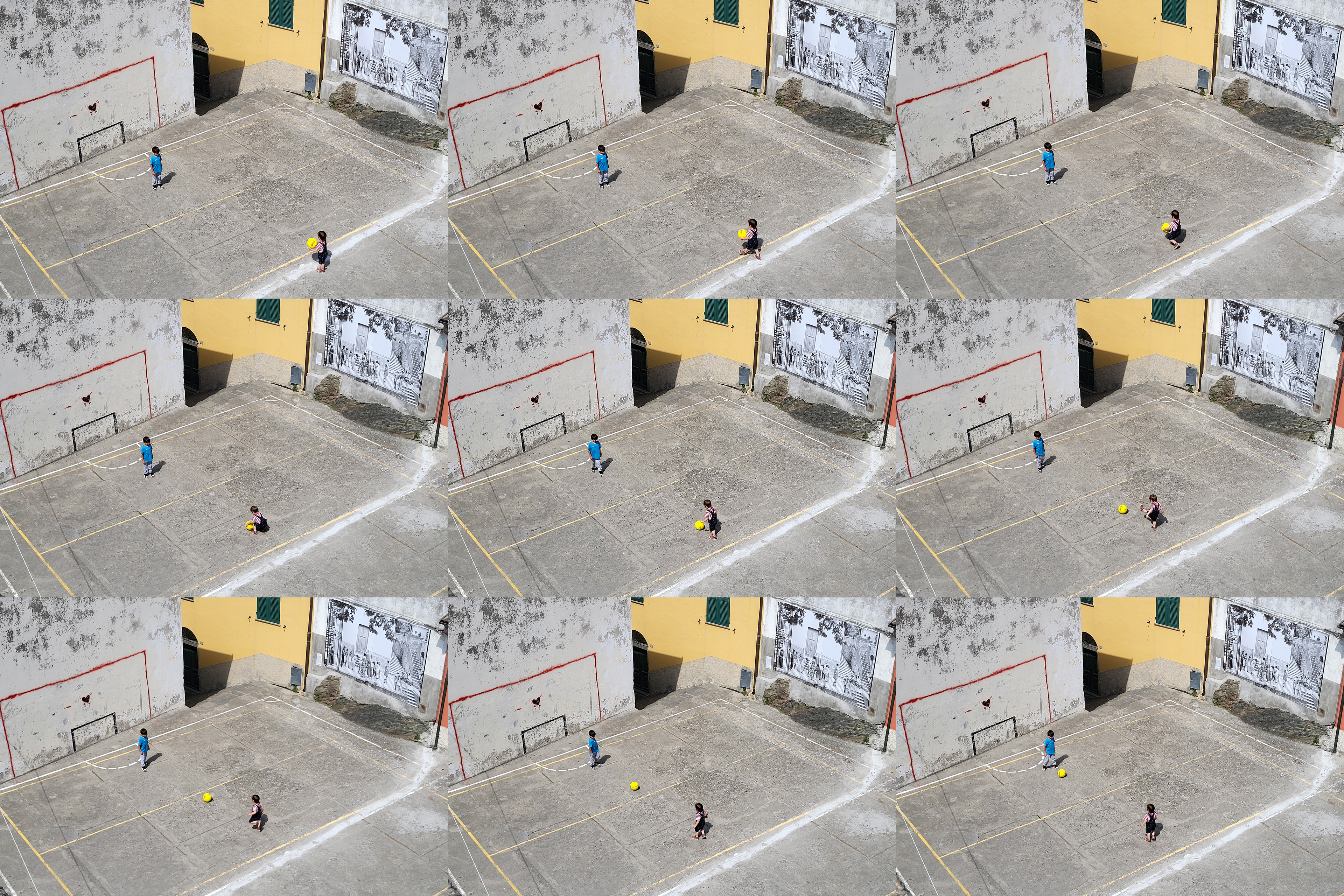 Two kids playing football, penalty style, Corniglia, June 2025.