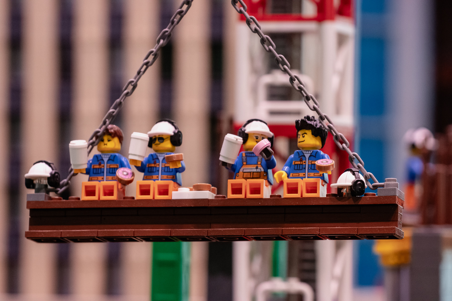 Lego construction workers taking a break at height.