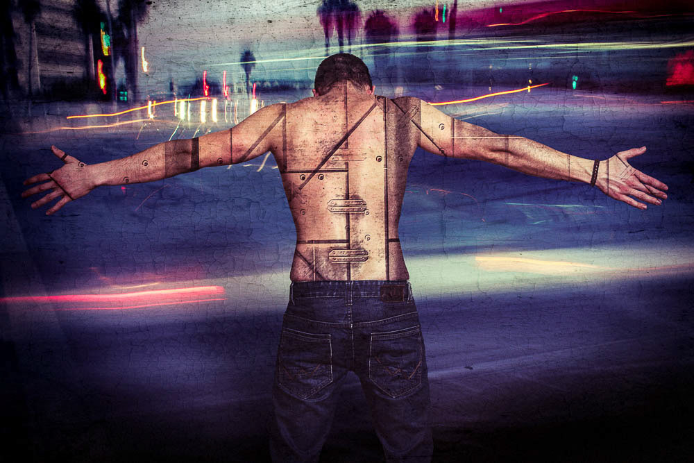 tatooed back man with lights