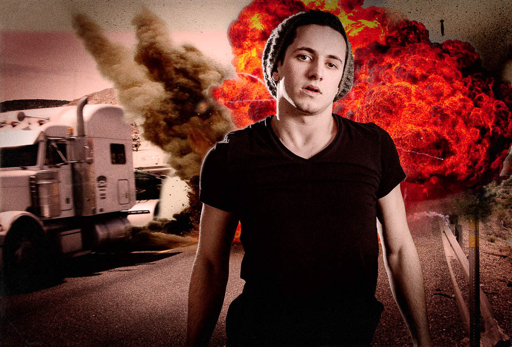 young man with cap in front of explosion