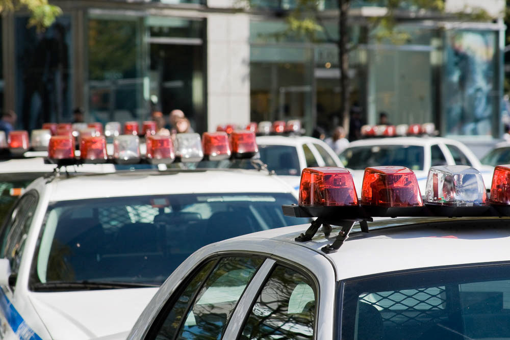 Queue of dozen police cars in New york streets.