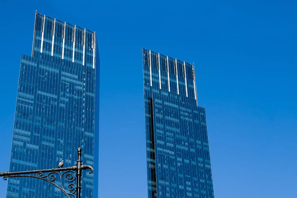 Blue towers on a dark blue sky.
