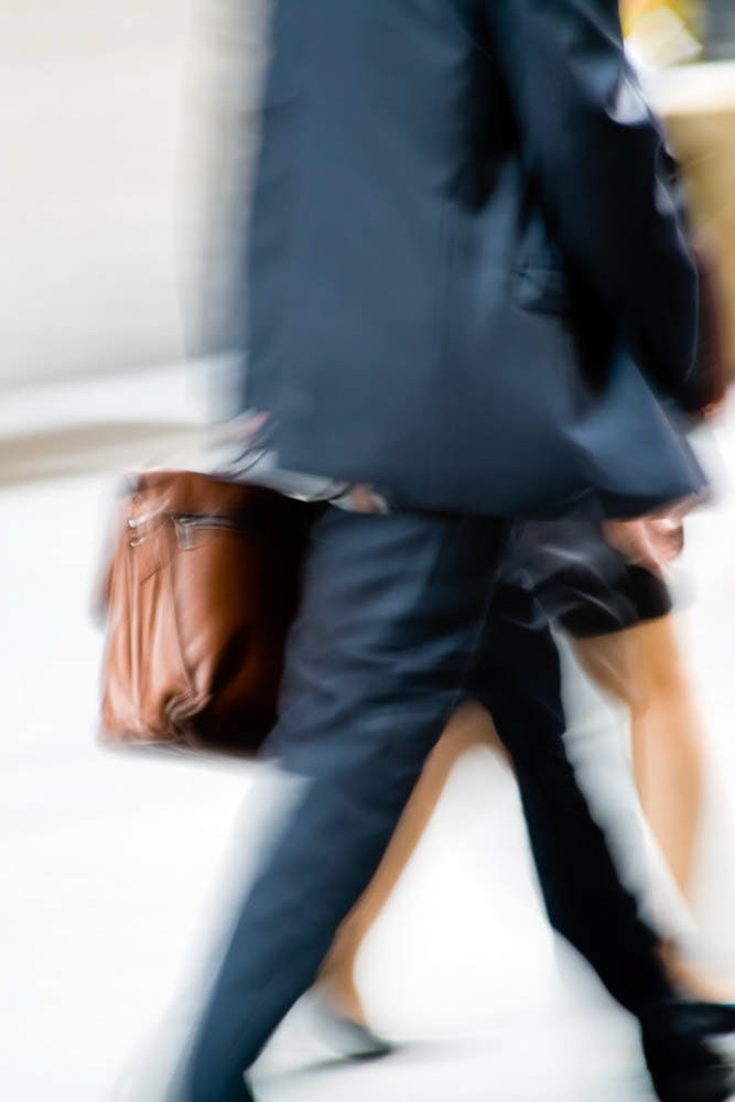 Business man in a hurry. Vertical shot.