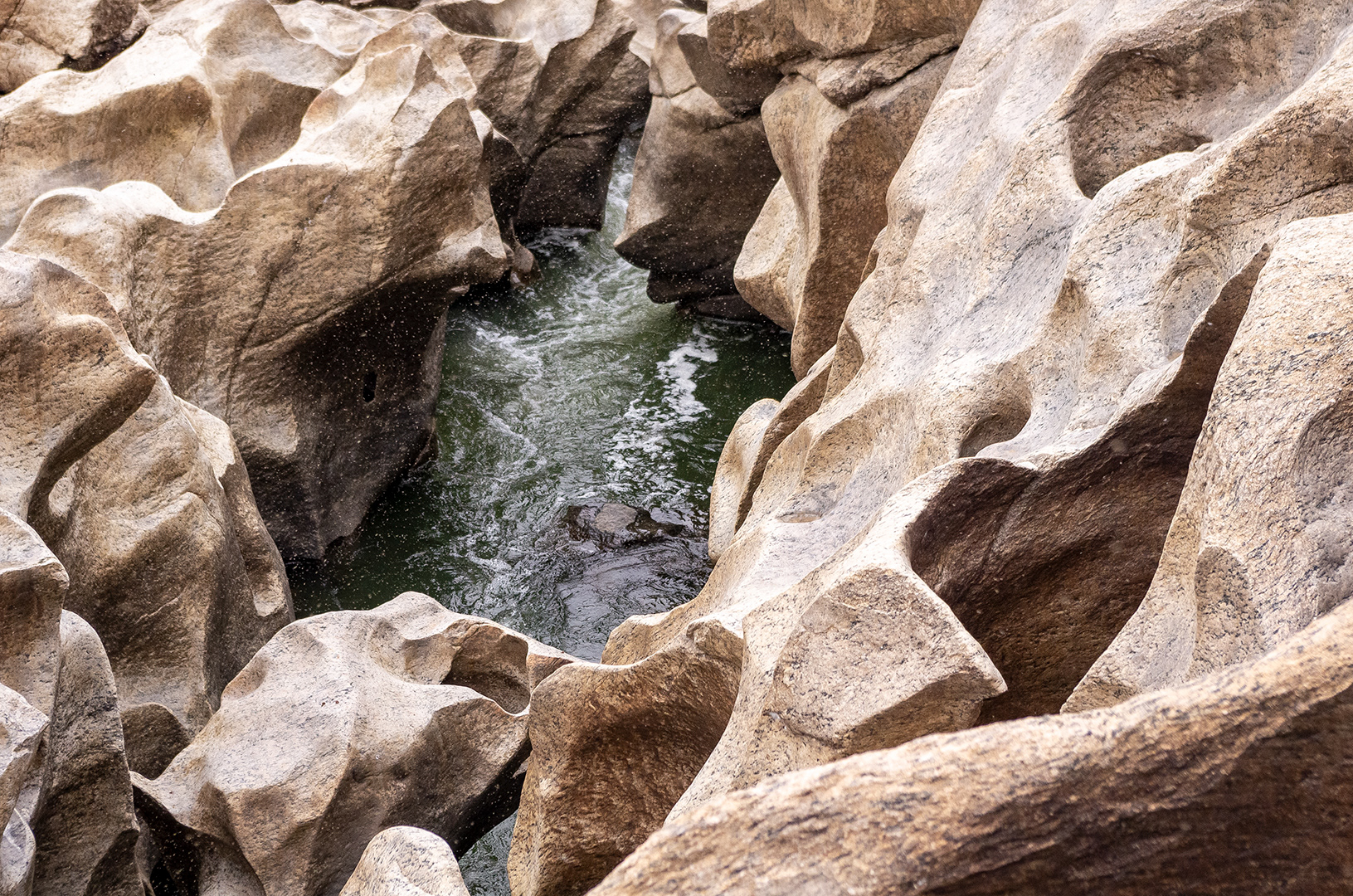 river worn stone cut like ribbons, fluid and organic