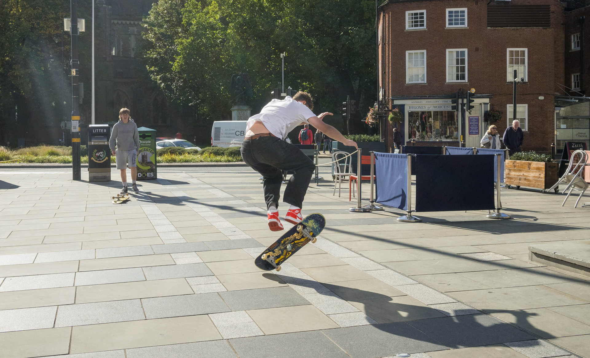Lads pulling skateboard tricks for me