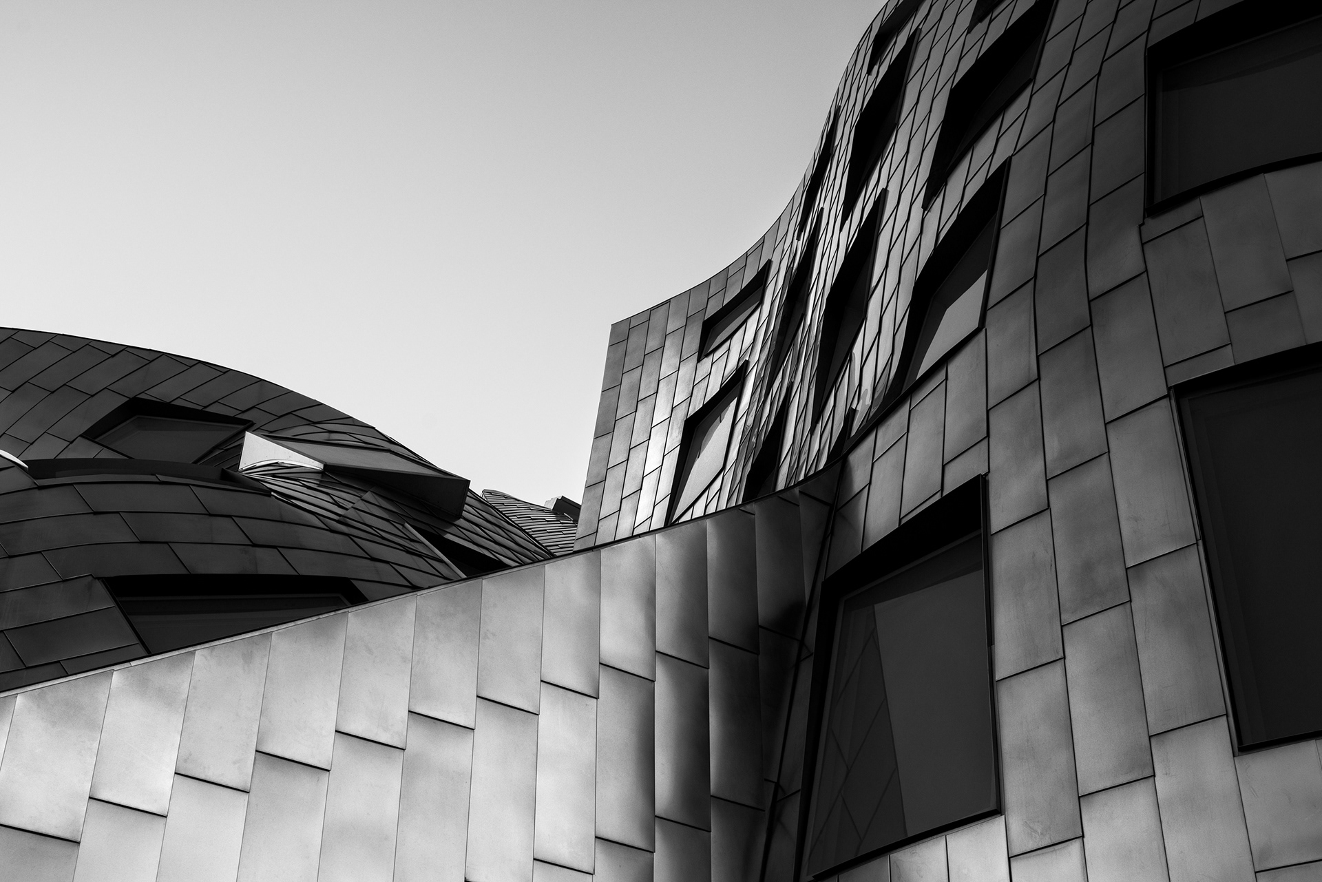 Black and white architectural detail of the stainless steel facade of the Cleveland Clinic Lou Ruvo Center for Brain Health in Las Vegas Nevada.
