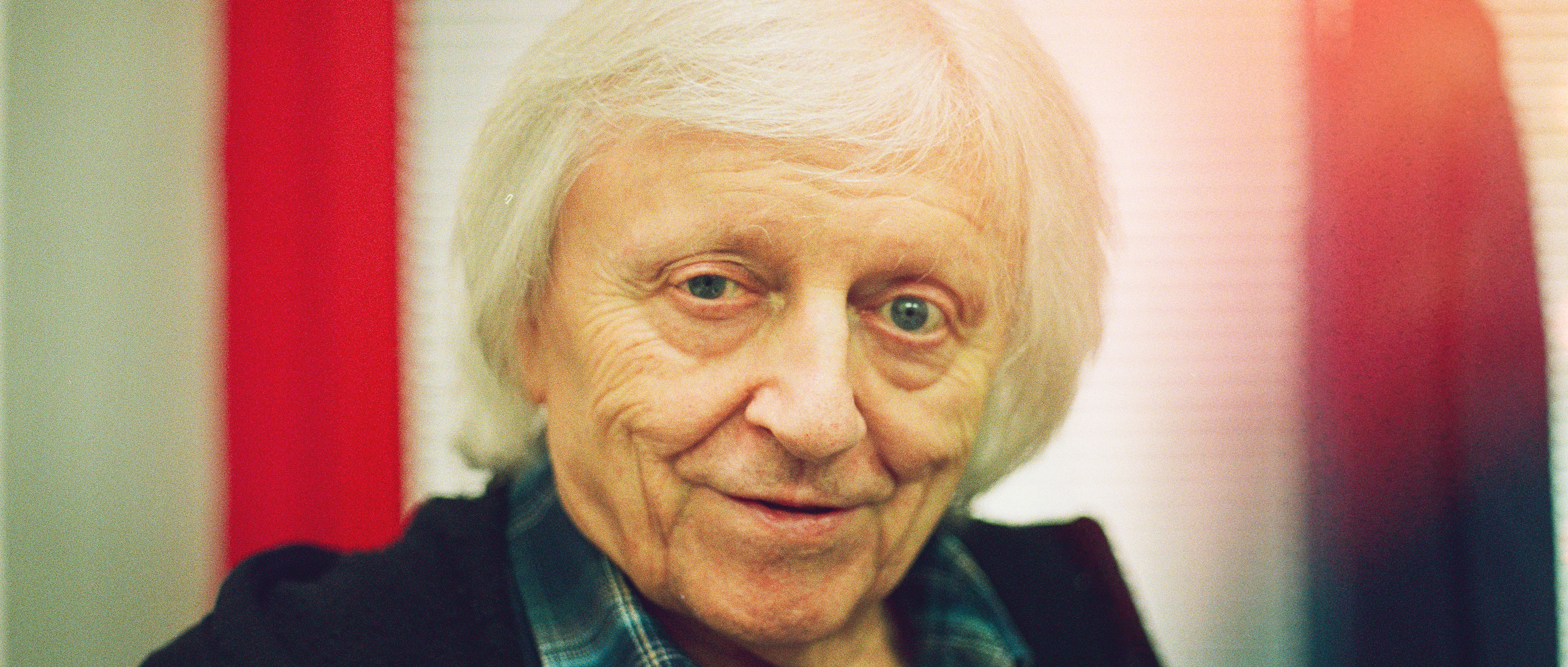 Intimate analog portrait of legendary singer Vaclav Neckar in concert backstage, soft film grain and warm tones / Intímny analógový portrét legendárneho speváka Václava Neckářa v zákulisí koncertu, jemné filmové zrno a teplé tóny.