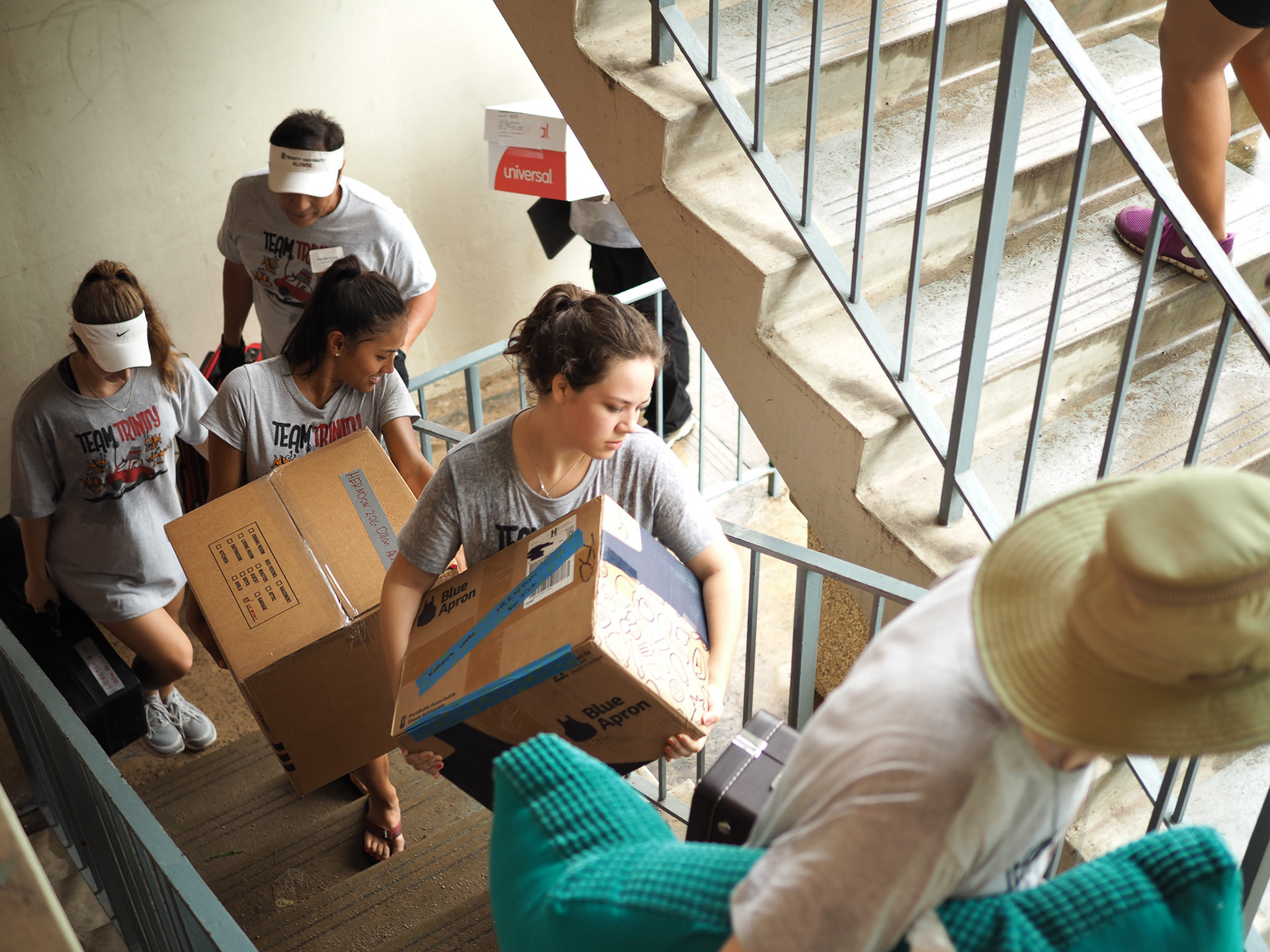 August 26, 2016 - Student, faculty, and staff volunteers carry first year's belongings up stairs to their new rooms. It's tradition at Trinity to give first years priority move-in before upperclassmen to allow extra time for adjustments to campus life.