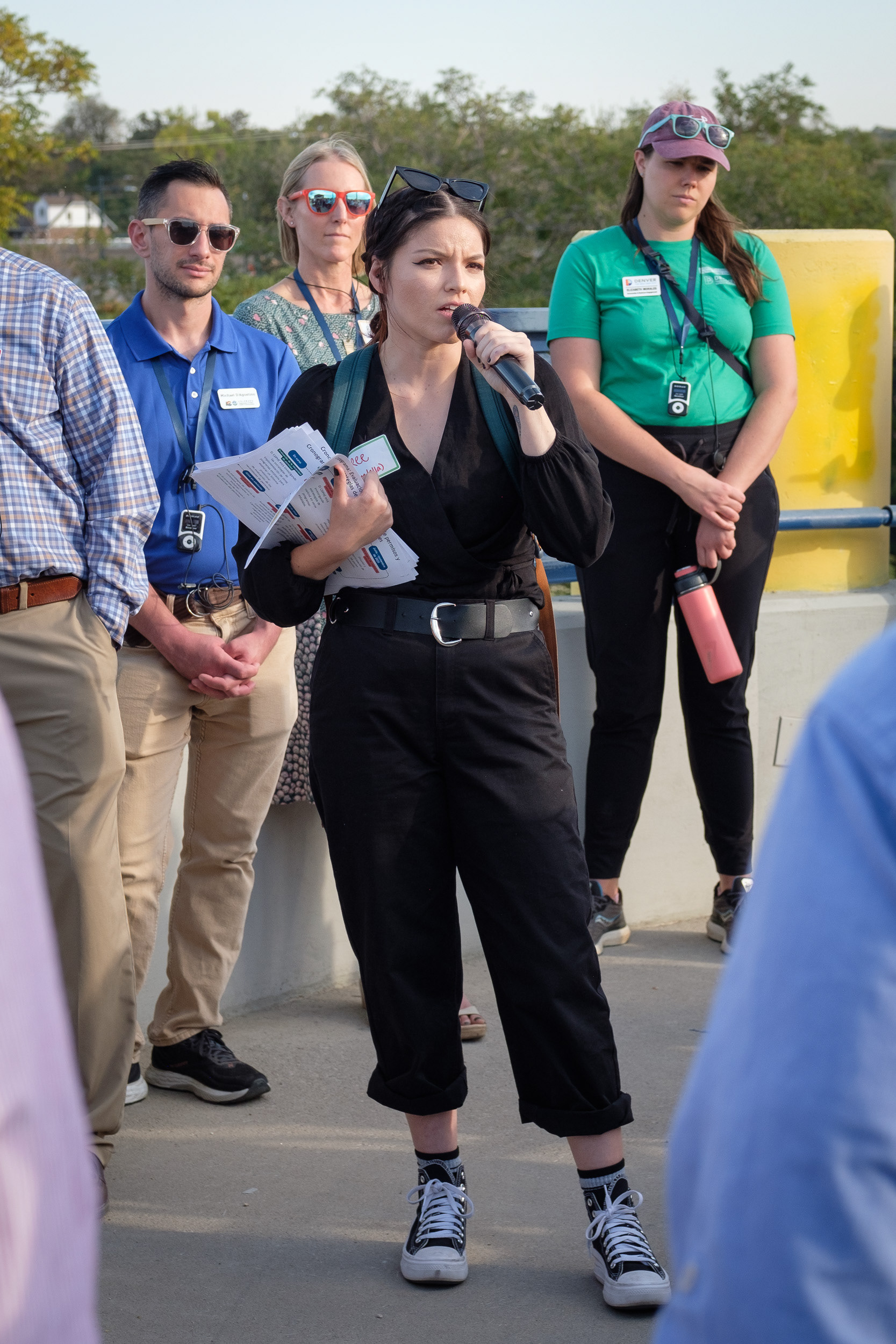 Breanna González, environmental justice advocate with the Colorado Department of Public Health, shares how she was inspired to change career paths into work with the government on air quality issues while working as an English teacher, and witnessing her students have nosebleeds, and struggle to breathe, eat, and sleep, Wednesday, Oct. 16, 2024, at the 47th and York Rainbow Bridge in Globeville, Elyria-Swansea. She shared that stories of community members and their experiences are often more impactful than the technical data alone. (Claudia A. Garcia, Special to The Colorado Sun)