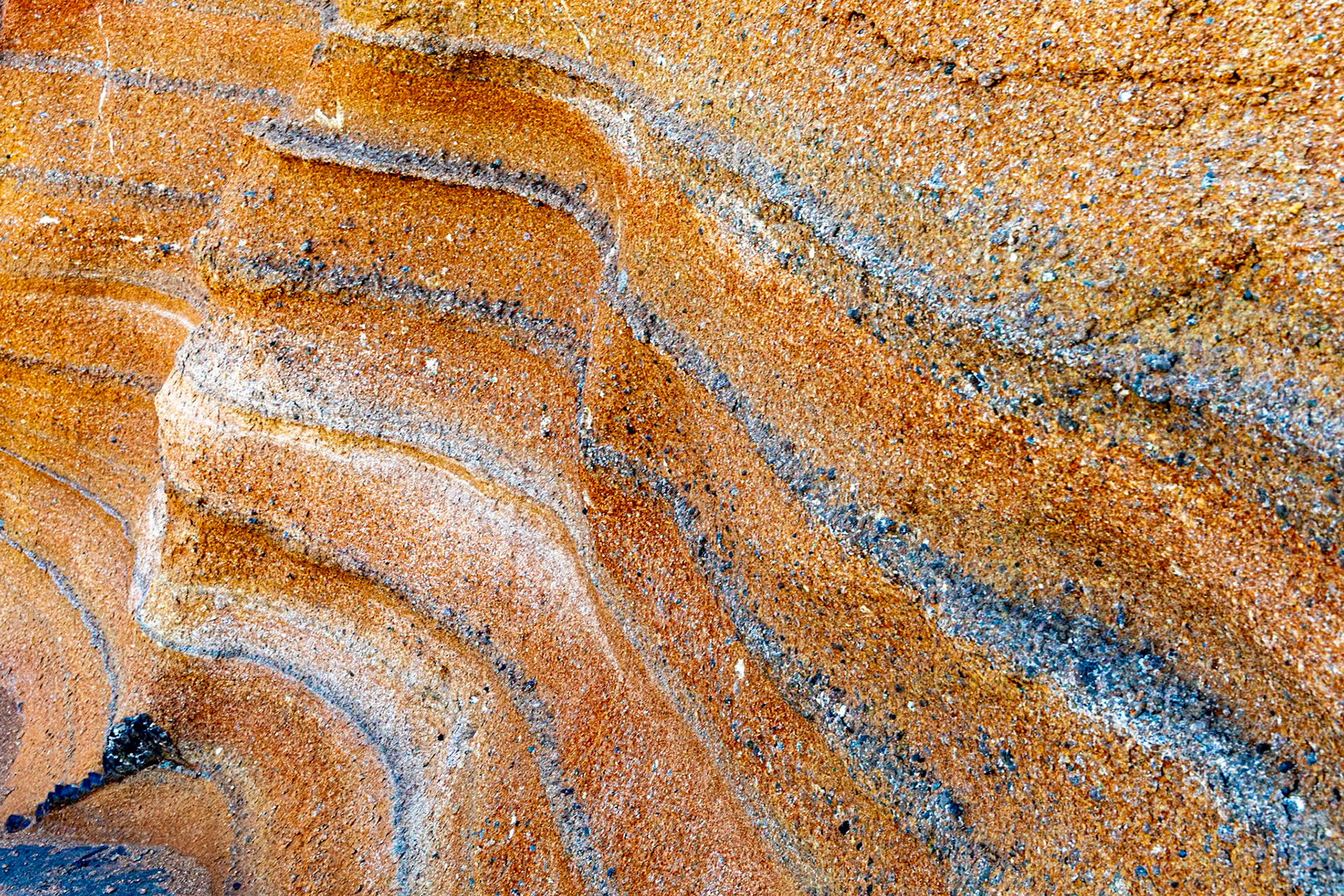 The black layers are probably ash from acient volcanic eruptions