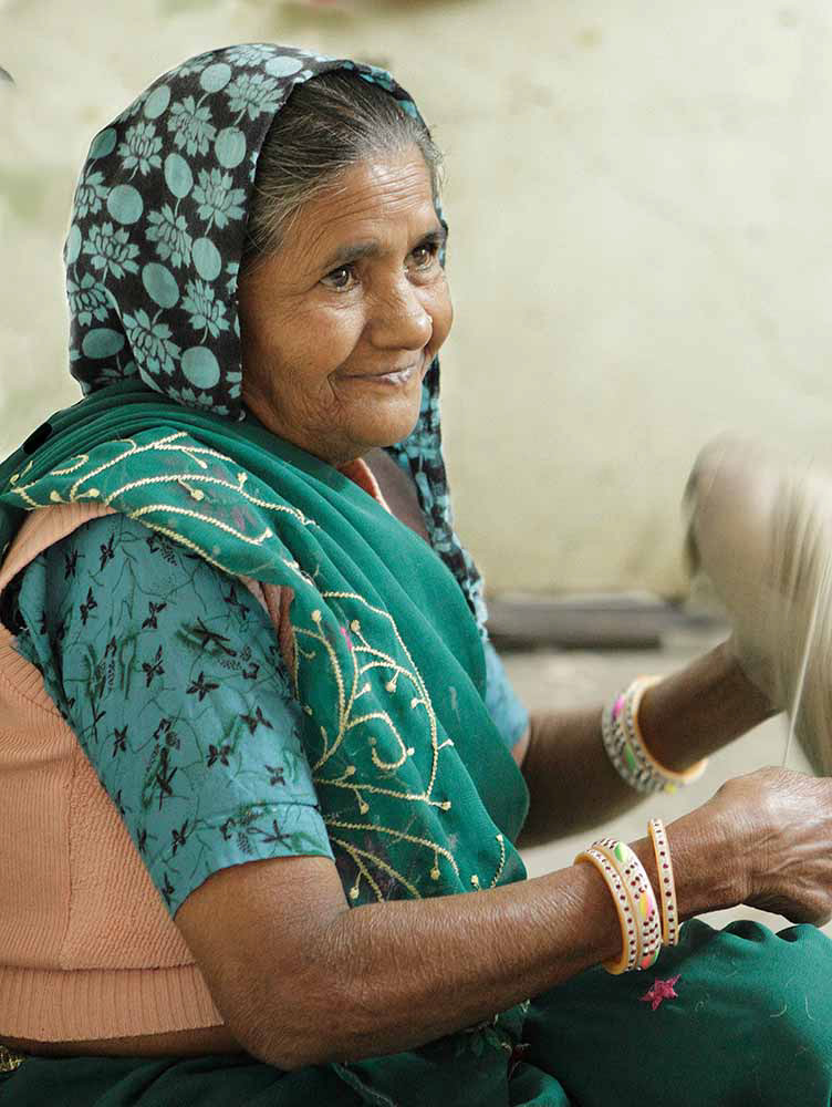 Spinning yarn, carpet factory, Rajasthan