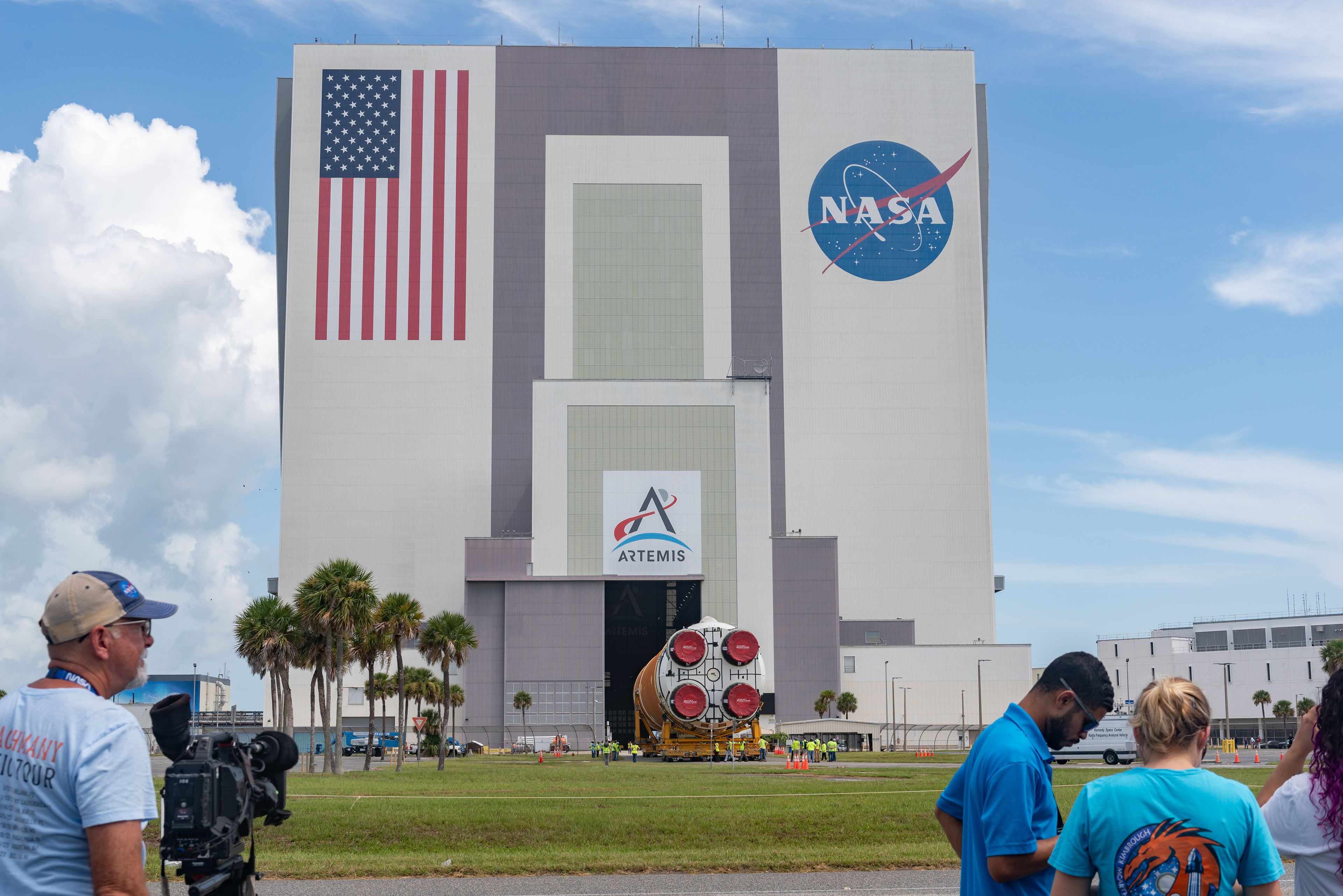 July 2024- Members of the media along with NASA employes watch the offloading and arrival of SLS Core Stage 2 at NASA's Kennedy Space Center.