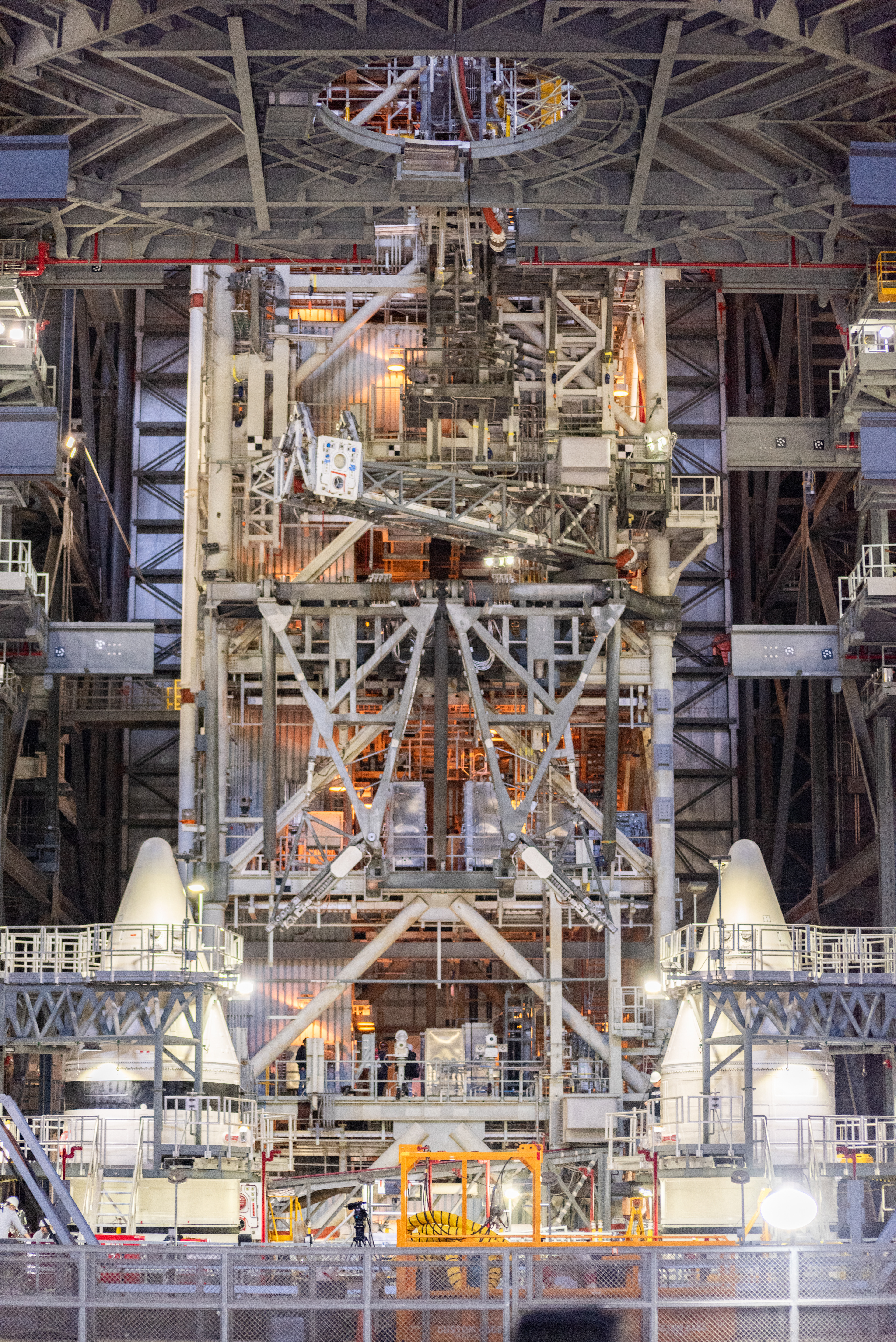 March 2025- The cones of the twin side boosters of SLS are seen inside the Vehicle Assembly Building during the early stages of the stacking process of the SLS rocket that'll launch Artemis II.