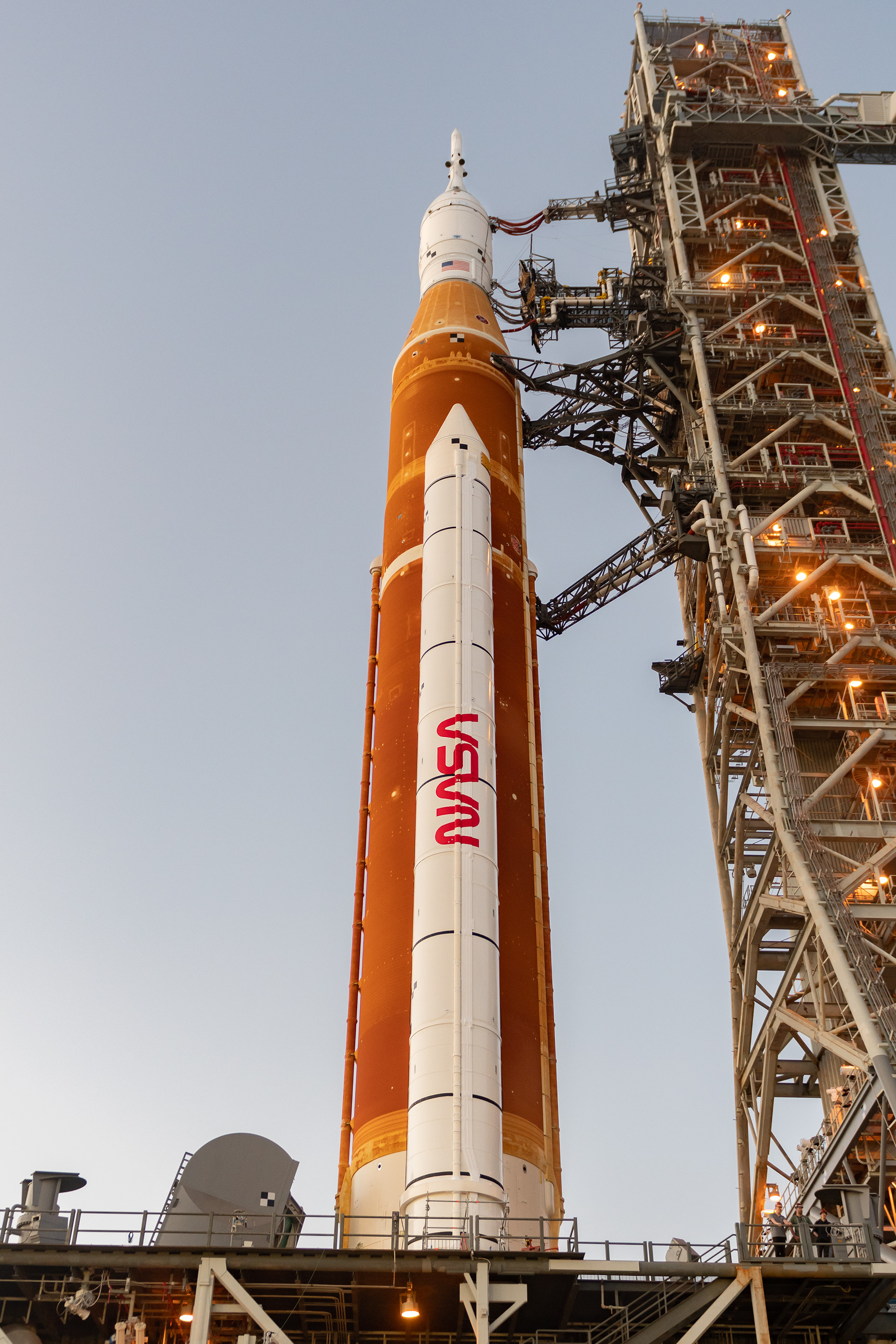 The NASA "Worm" logo is seen on the side of the booster.