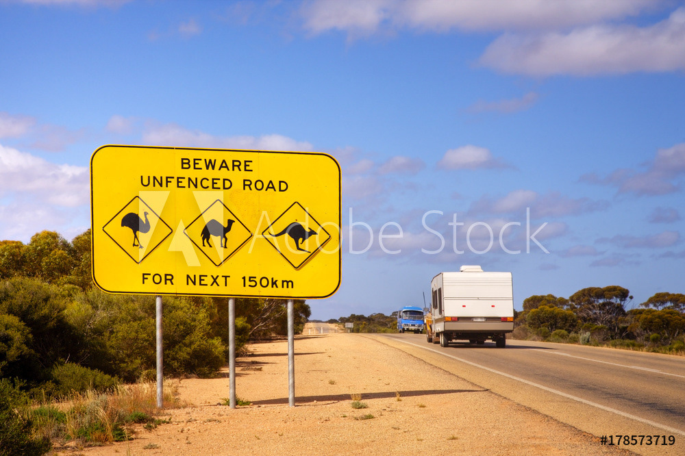 Caravan Passing Famous Sign on Nullarbor Plain