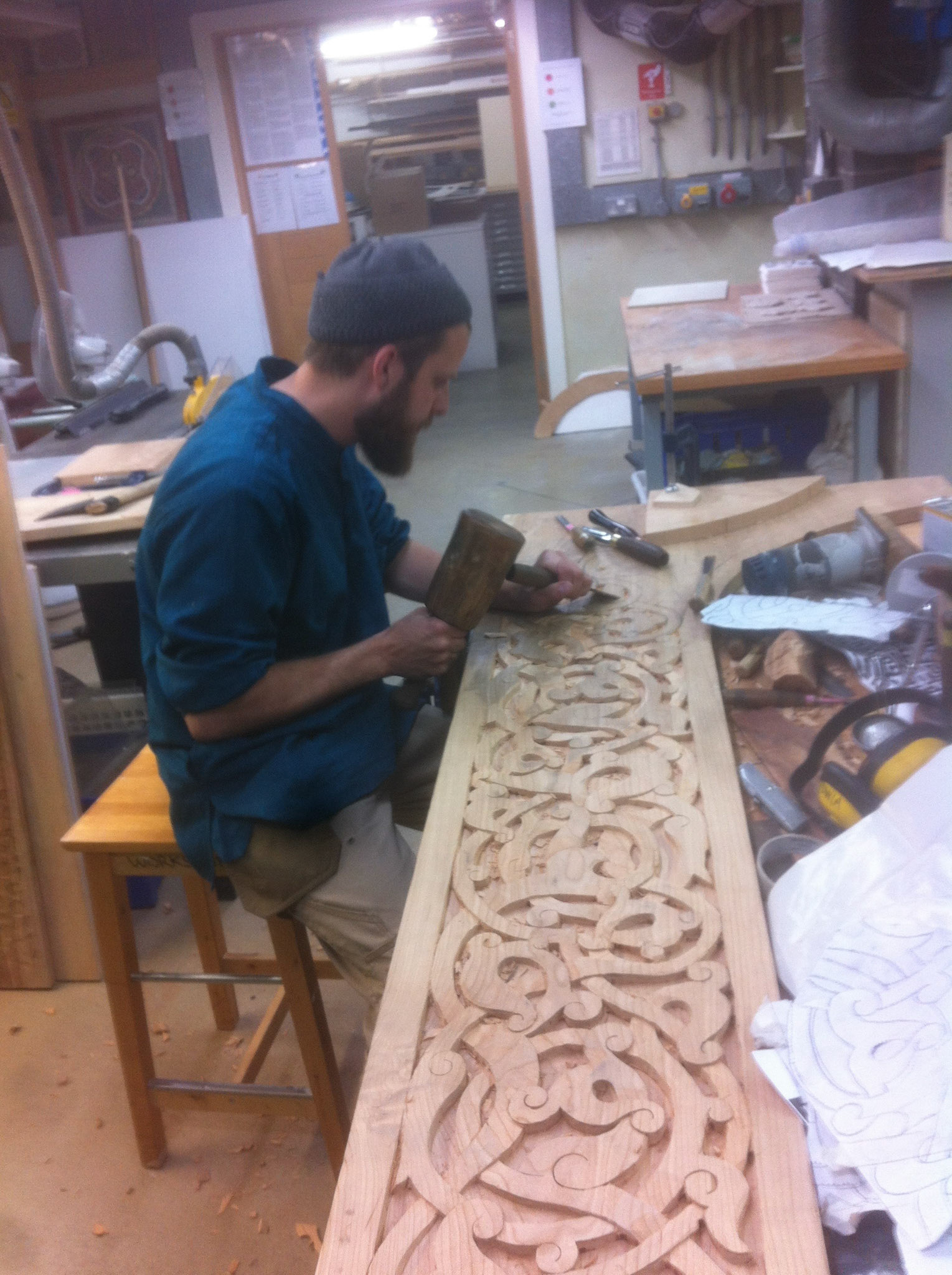 Carving the pattern with chisels, gouges and mallet