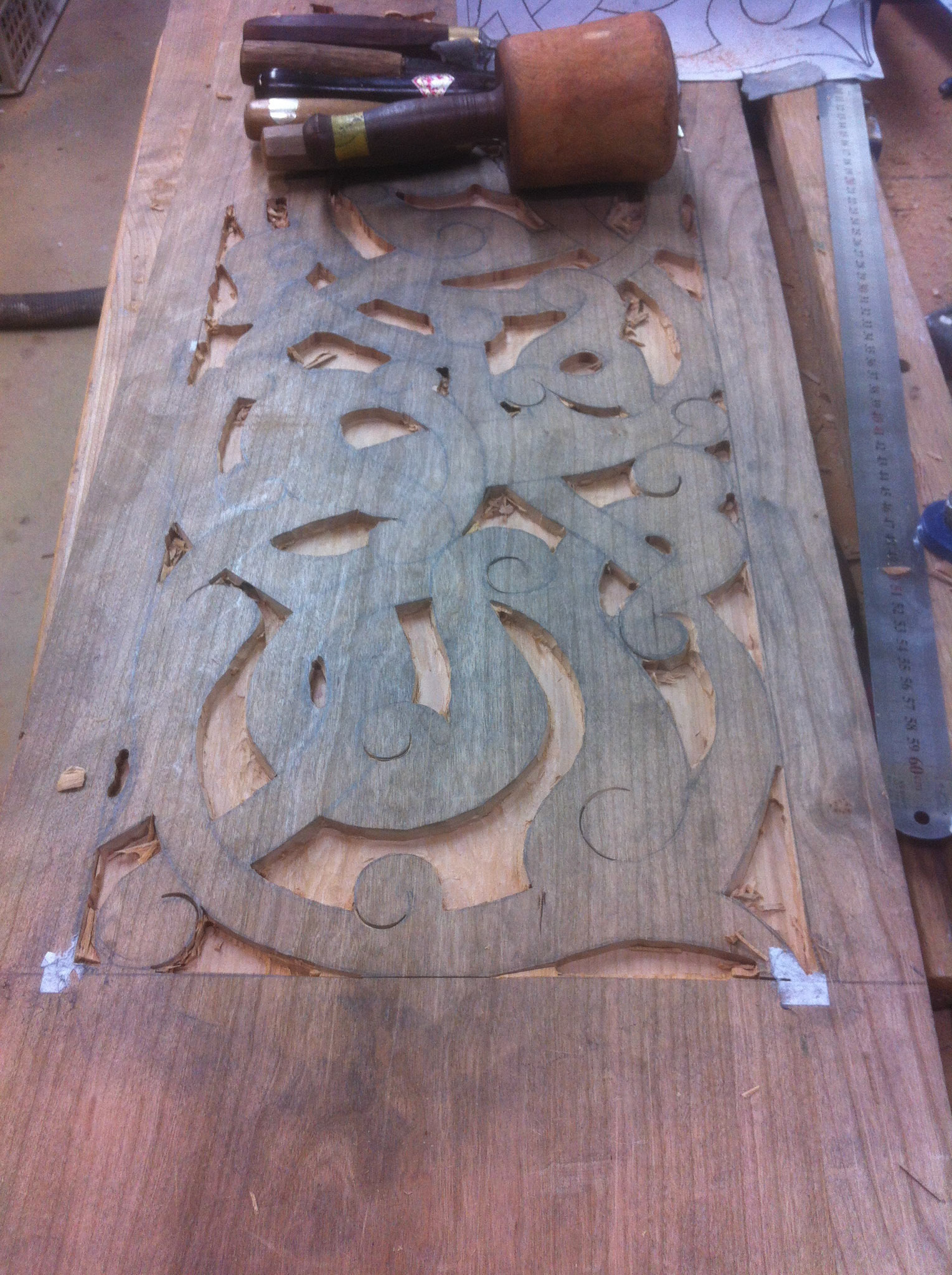 Carving the pattern with chisels, gouges and mallet