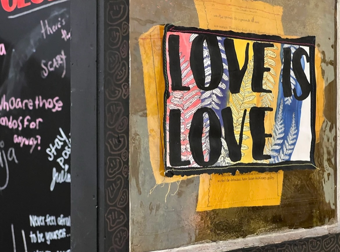 Close-up of Please, Look in Front of You, 2022, Antique church window, cyanotype on paper, thread, acrylic, sharpie, wood, soil, succulent, Salisbury University