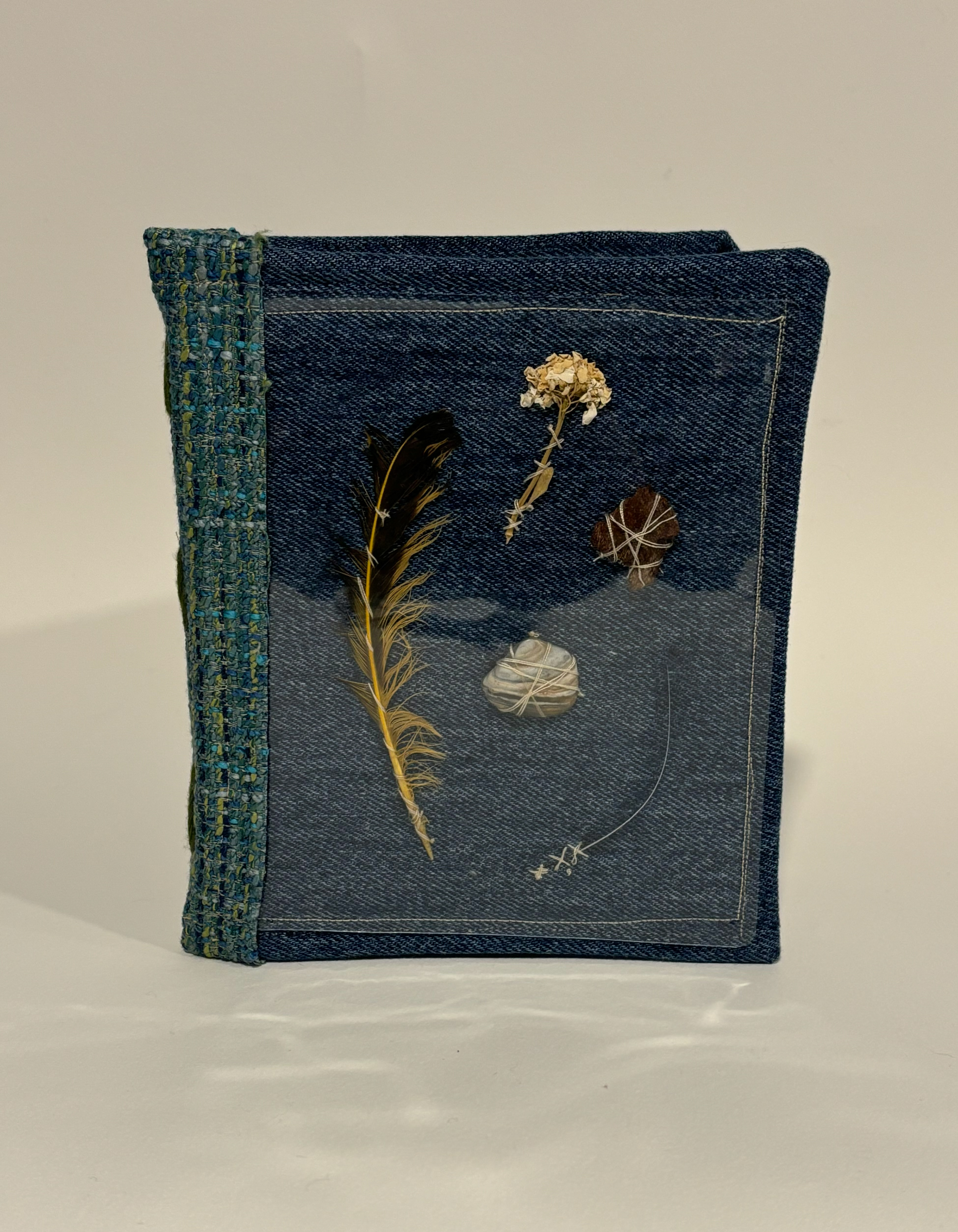 Book Project for Finding Words Class at MICA, 2025, Cardboard, thrifted fabric, glue, feather, dried flower, shell, wood, whisker from my cat peanut, Ellicott City MD