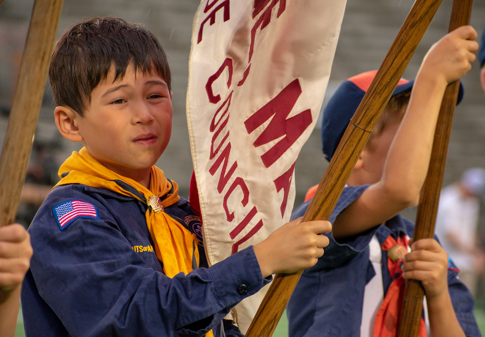 Boy scout displays color gaurd prior to the Major League Lacrosse All Star Game on June 28th 208 at Harvard Stadium in Allston MA.