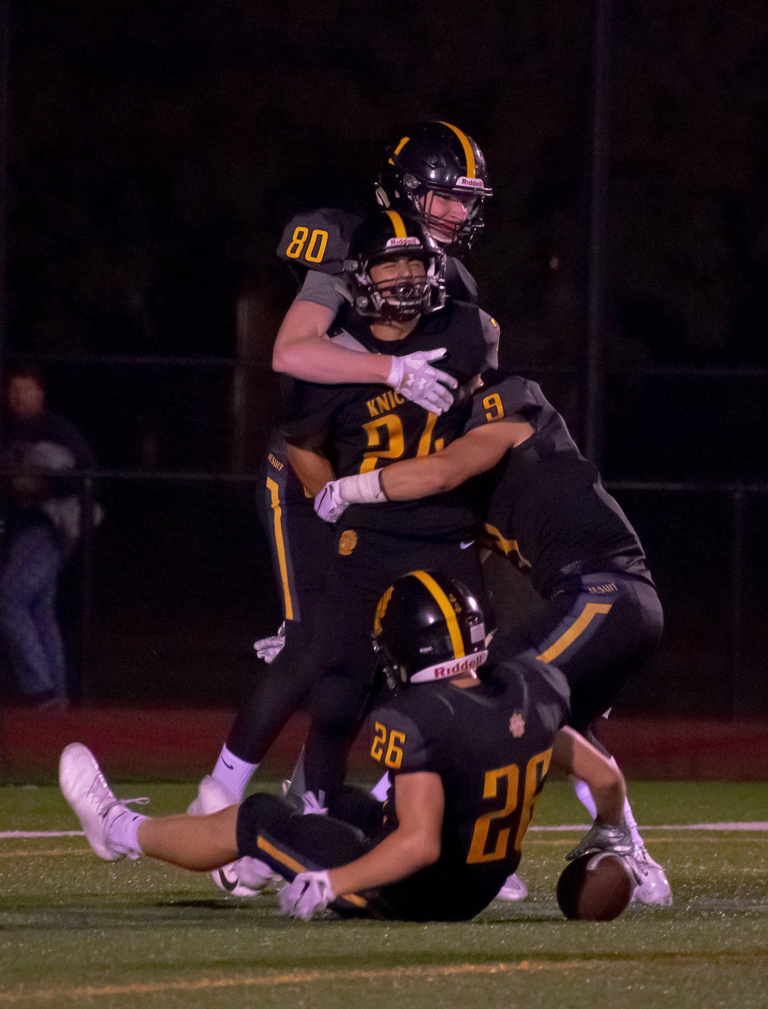 Senior running back Mark Passero (24) of McQuaid Jesuit celebrates his touch down with teammates Casey Howlett(26), Ben Beauchamp(9) and Eric Schertler(80), during the McQuaid Jesuit and Canisius High School Varsity Football game at McQuaid Jesuit High School on September 7th 2018 in Brighton NY.