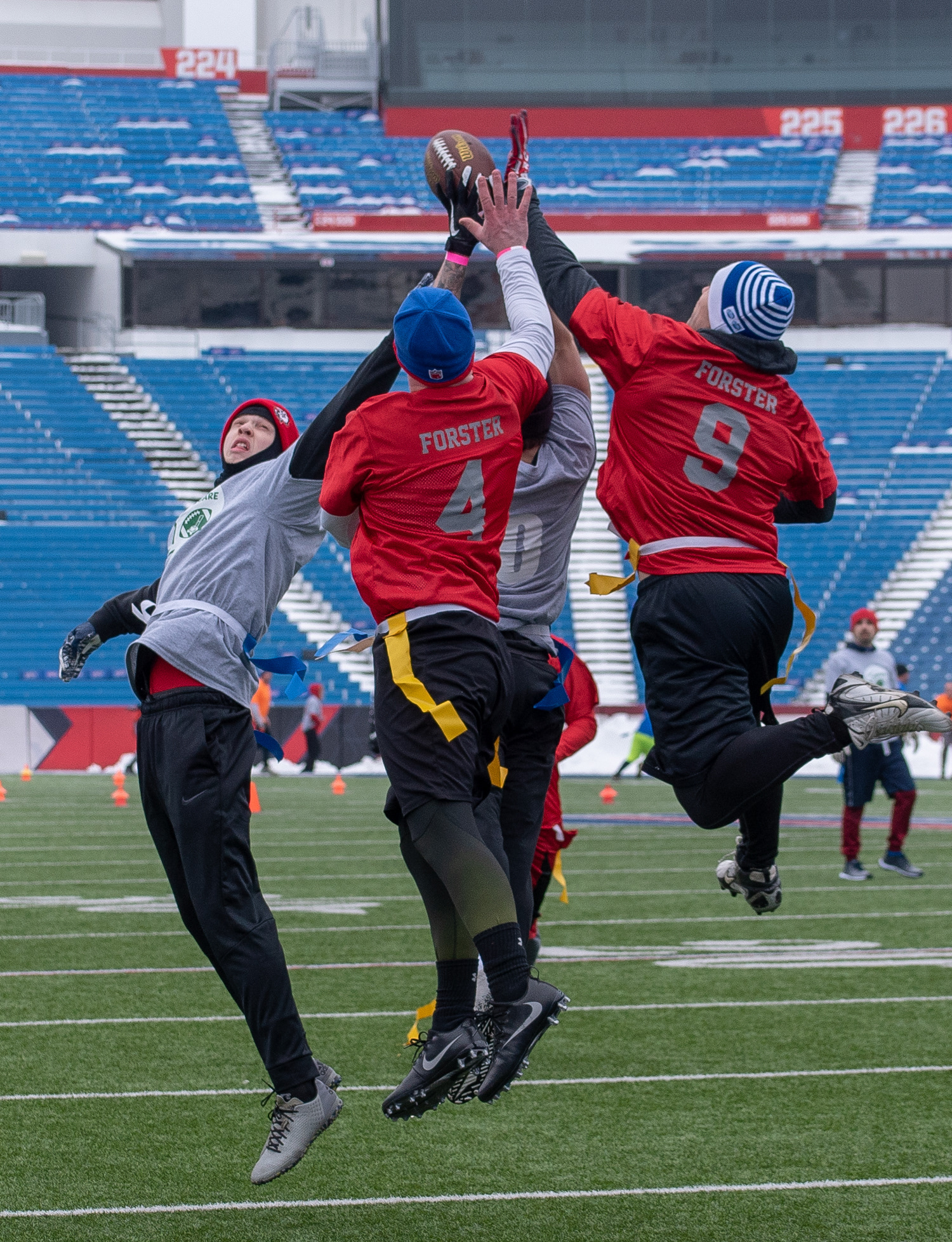 Members of the Forster family attempt a catch in the end zone during The Buffalo Snow Bowl, in benefit of Special Olympics, on March 2nd, 2019,  at New Era Field in Orchard Park New York
