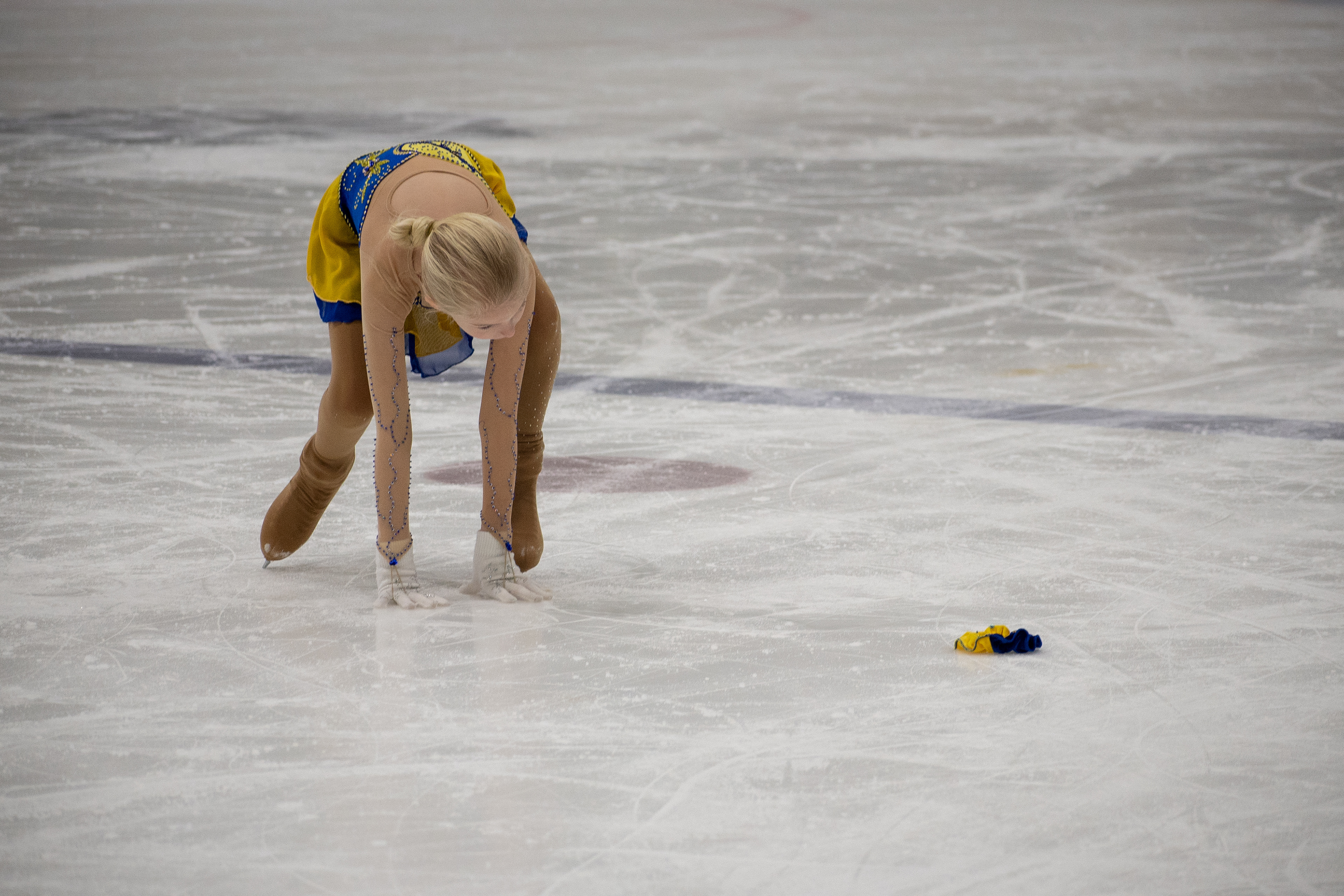 Austynn Willson pauses her program to retrieve her hair tie during her event at  Special Olympics New York, on February 24th, 2019,  at the Genesee Valley Sports Complex in Rochester New York.