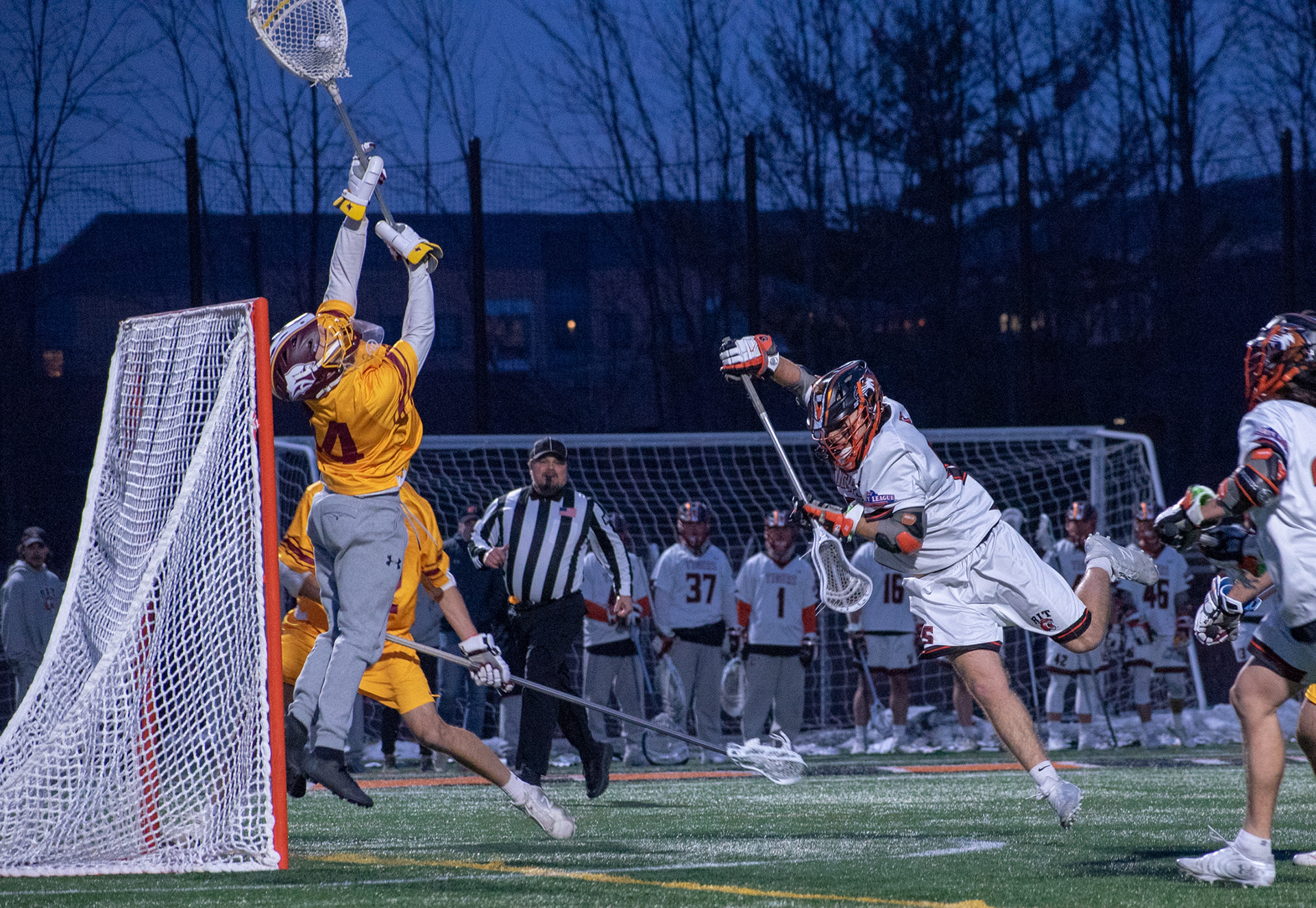 Goalie Darin Eakins(44) of St. John Fisher saves shot by junior attackman, Shawn Nally(15) of RIT, during the RIT v St John Fisher game on March 20th 2019 at the RIT Turf in Henrietta NY 