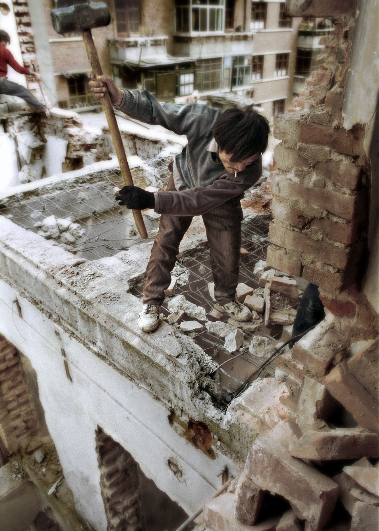 Construction worker demolishing a building, Beijing