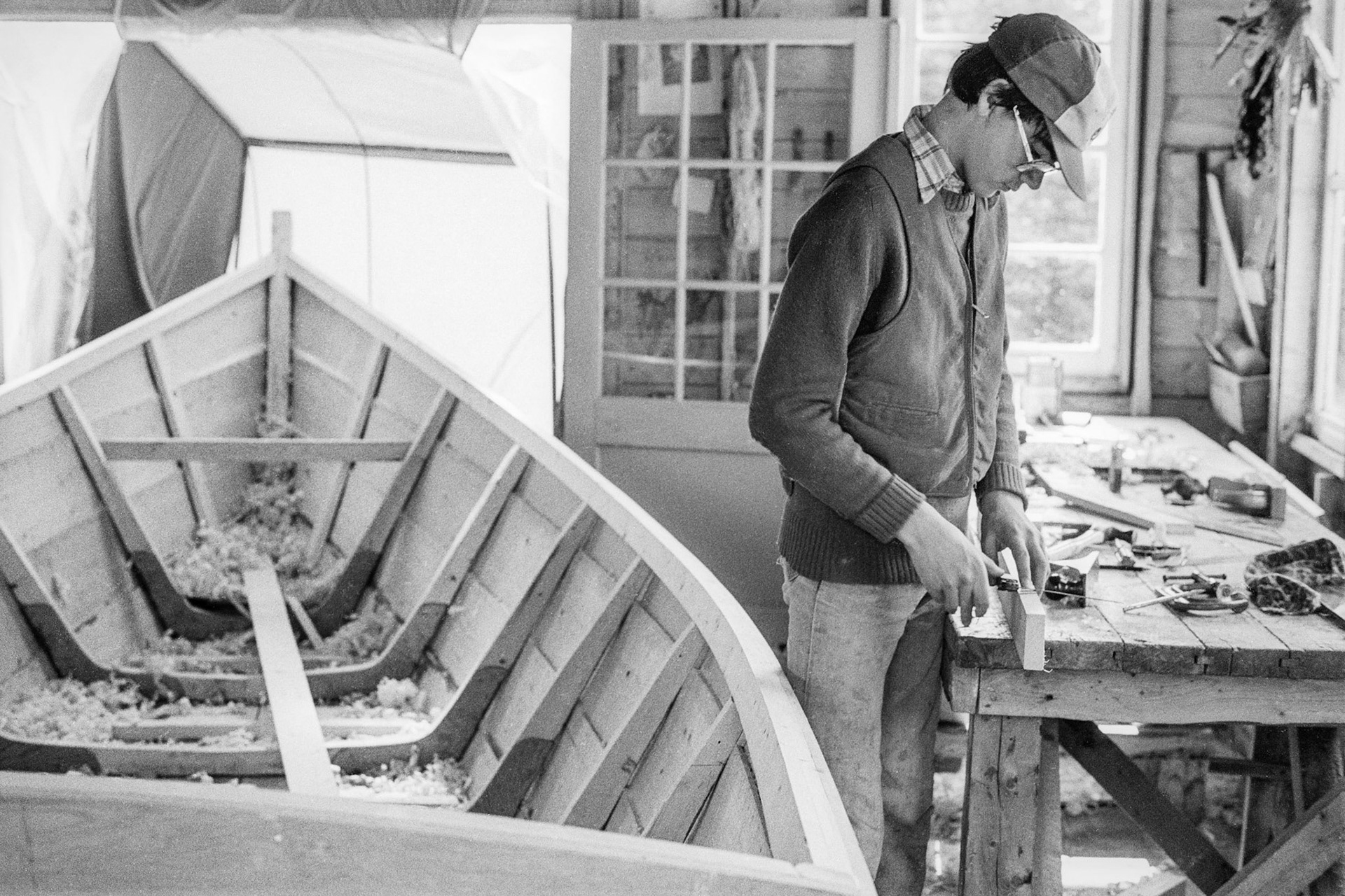 Tom Wright building a dory, Port Kirwan, 1980