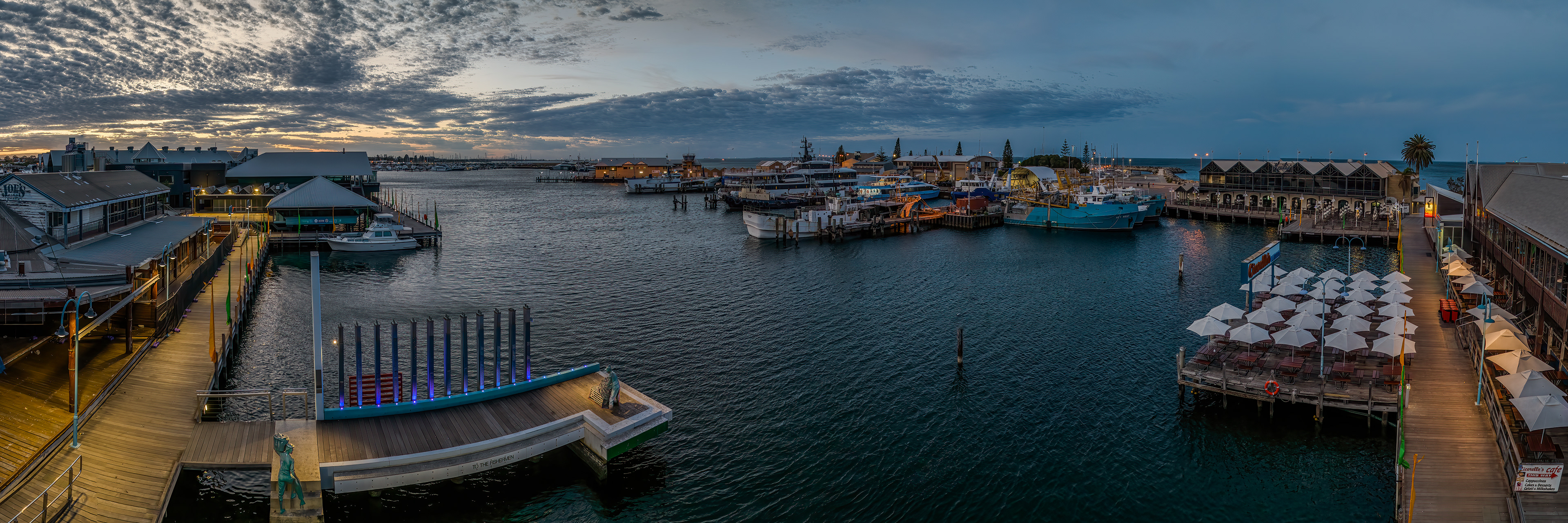 Drone HDR panoramic image of Fremantle Fishing Boat Harbour at sunrise on a windy morning.