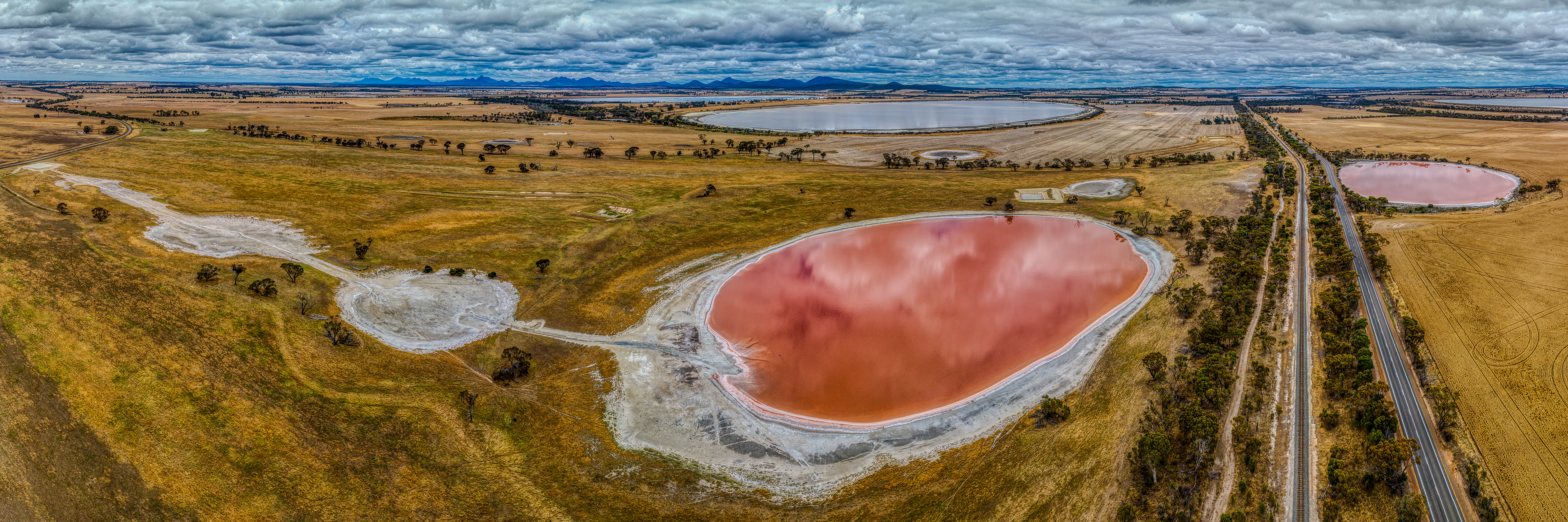 Drone panorama of pink salt lakes in the wheatbelt town of Cranbrook, Western Australia