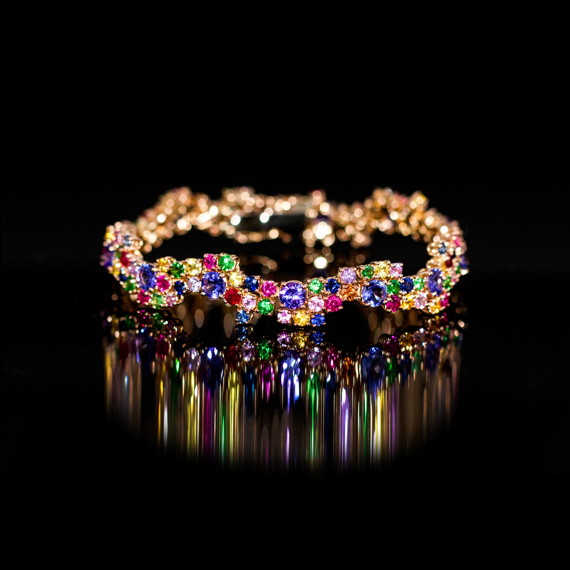 Bracciale Tennis in oro 18 kt con Zaffiri multicolor, Tsavoriti e Tanzaniti