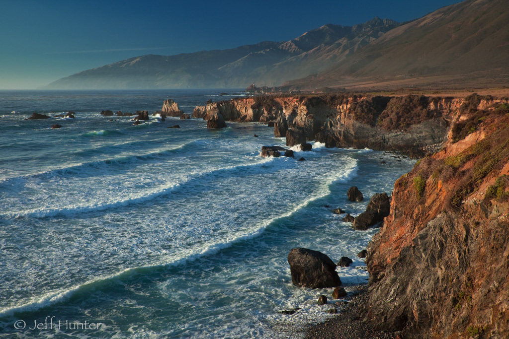 Dramatic coastline with cliffs and waves