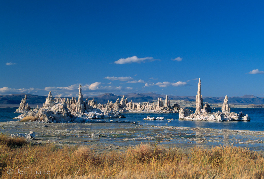 dramatic tufa formations in a lake