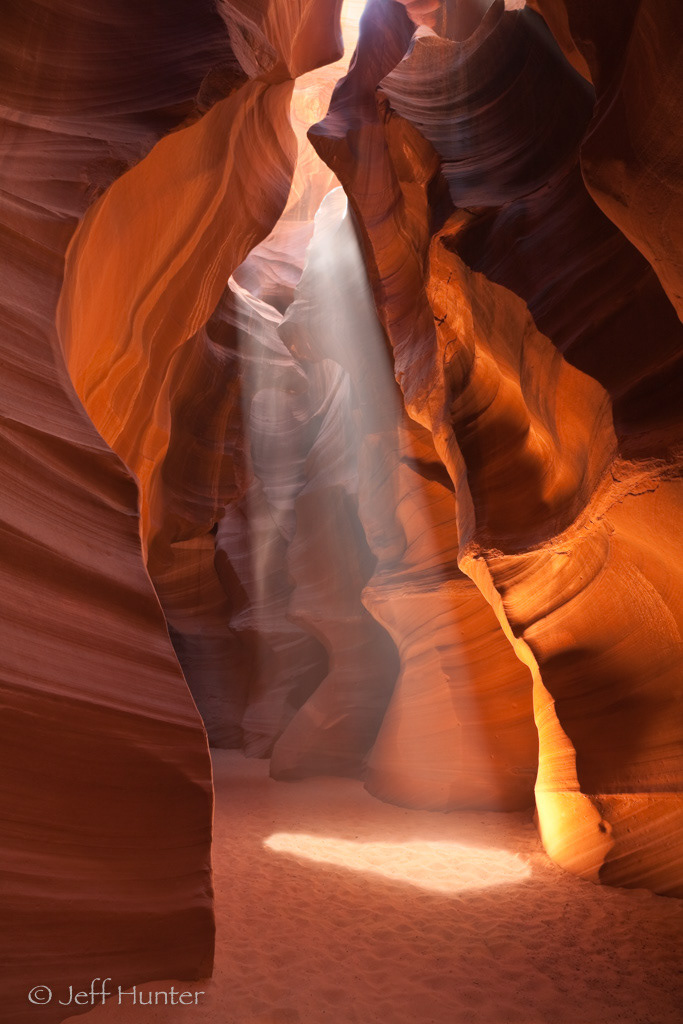 A slot canyon with shaft of light