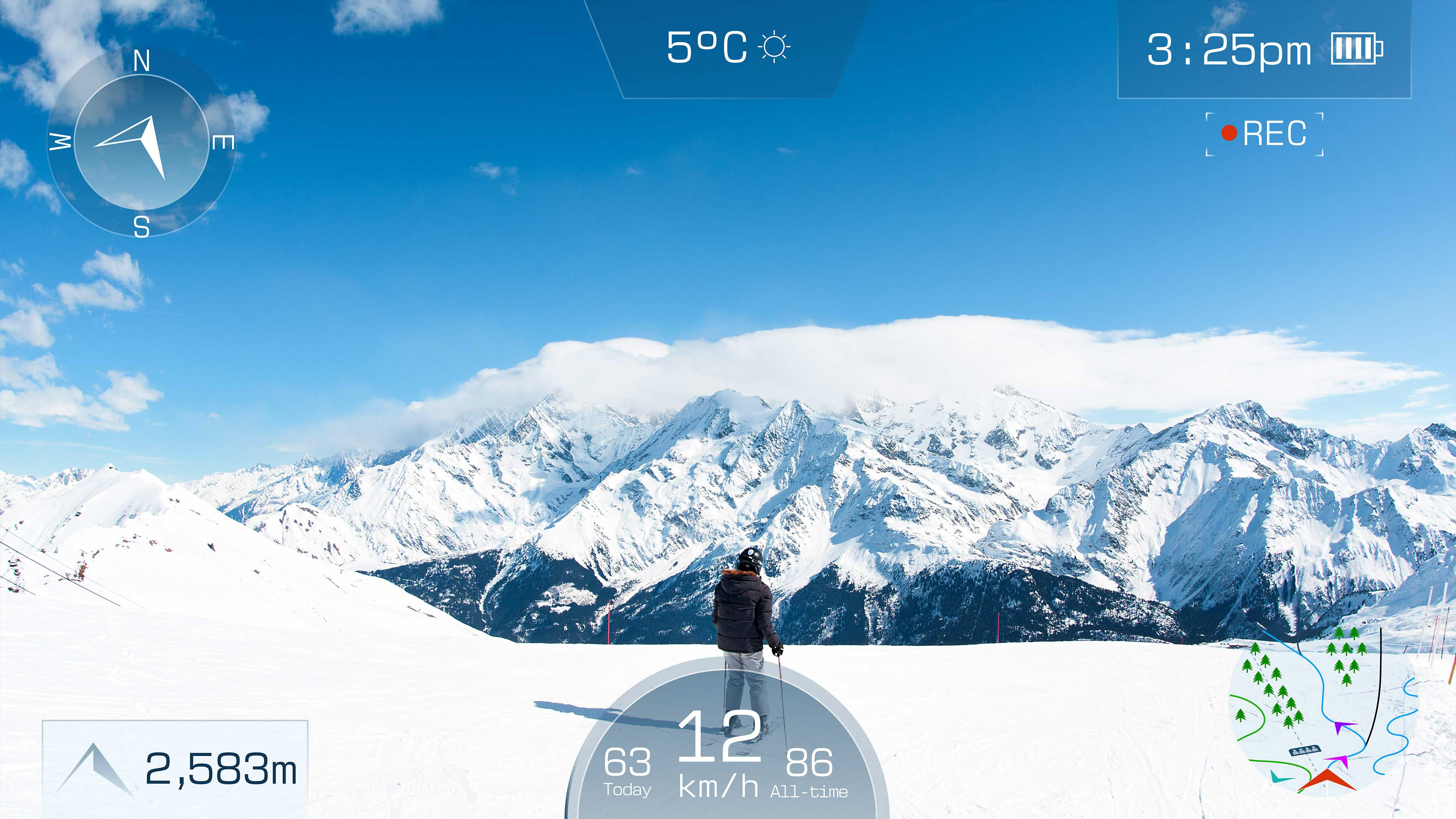 The camera pans closer to the goggles, as if putting them on, until the skier’s POV takes up the full screen. Live updating customized HUD visual effects are displayed on the video. A flashing record icon appears in the HUD and the friends head down the mountain. Environmental sound effects fade in such as wind and birds chirping.