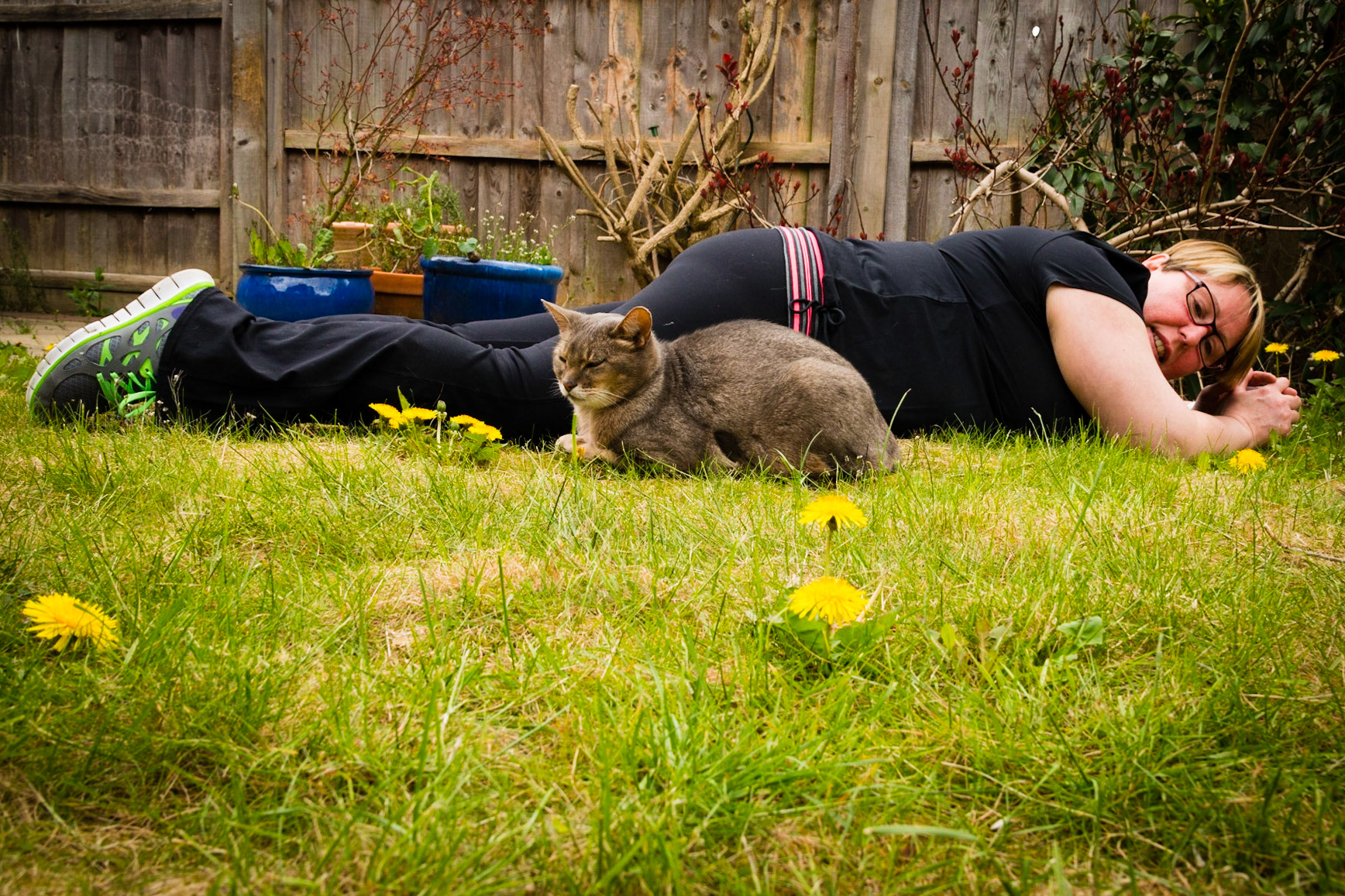 In the garden taking pictures of the cat, only the cat wants to cuddle with Chez!