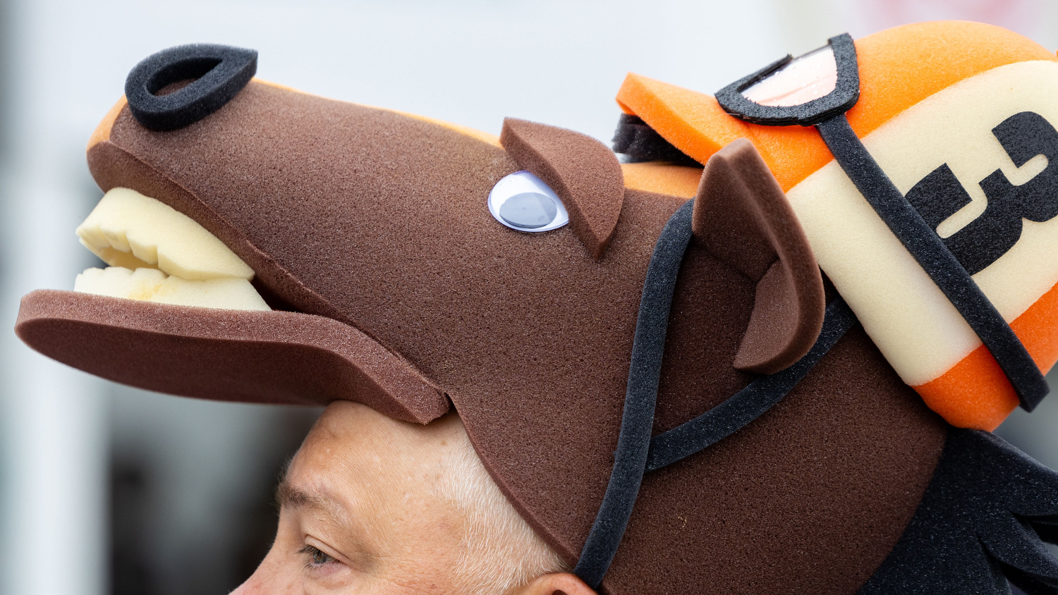 Brian bush of Pennsylvania is adorned with a horse hat he bought online for the 151st running of the Kentucky Derby horse race at Churchill Downs in Louisville, Ky. on Saturday, May 3, 2025.