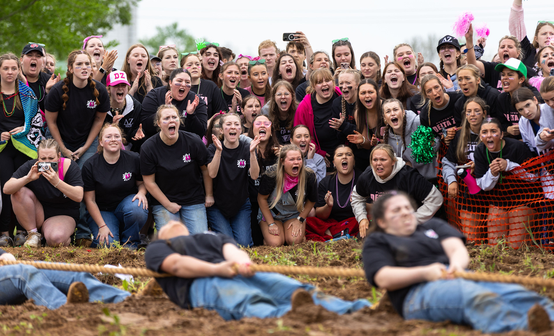 Delta Zeta sorority members cheer on their “Tug” team during the annual WKU Greek Week “Tug” competition on Friday, April 19, 2024.