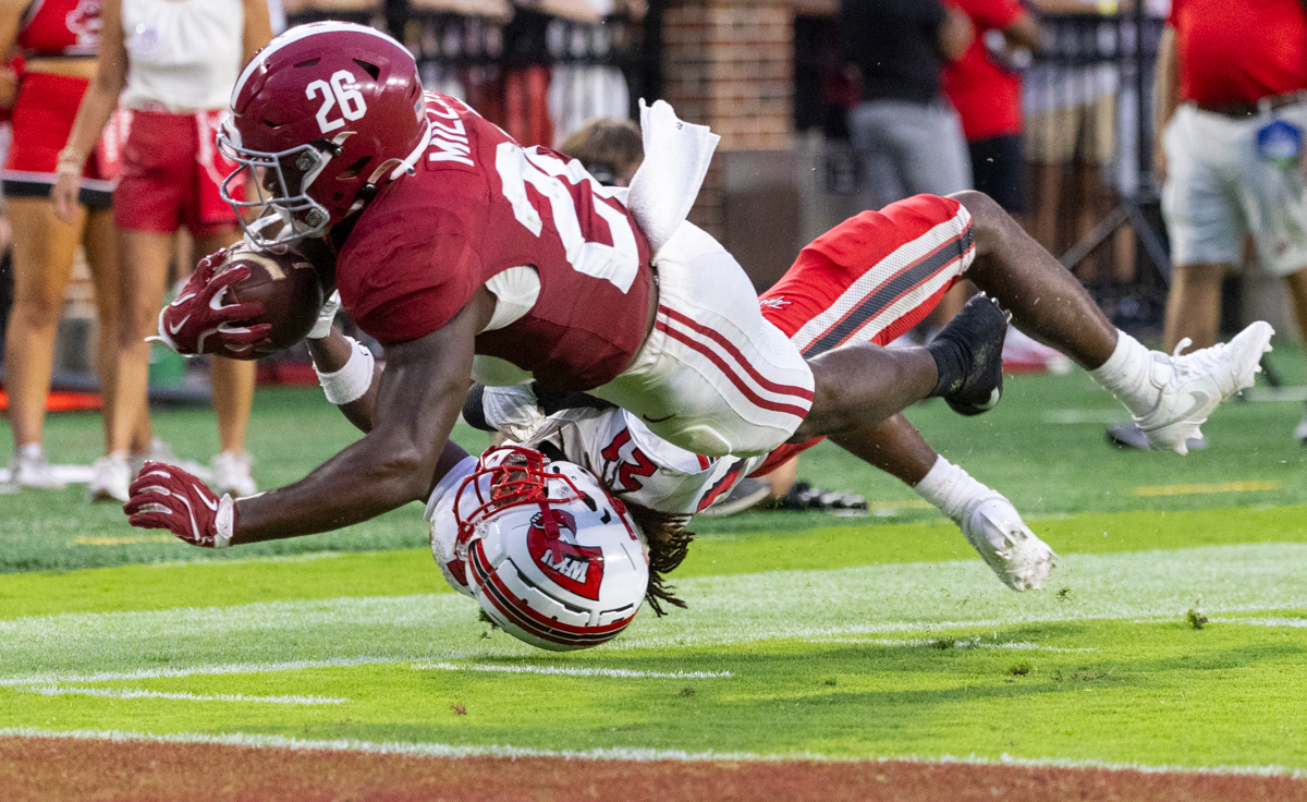 Alabama Crimson Tide running back Jam Miller (26) dives into the end zone for a touchdown during a game against Western Kentucky University at Bryant Denning Stadium in Tuscaloosa, Ala. on Saturday, Aug. 31, 2024.