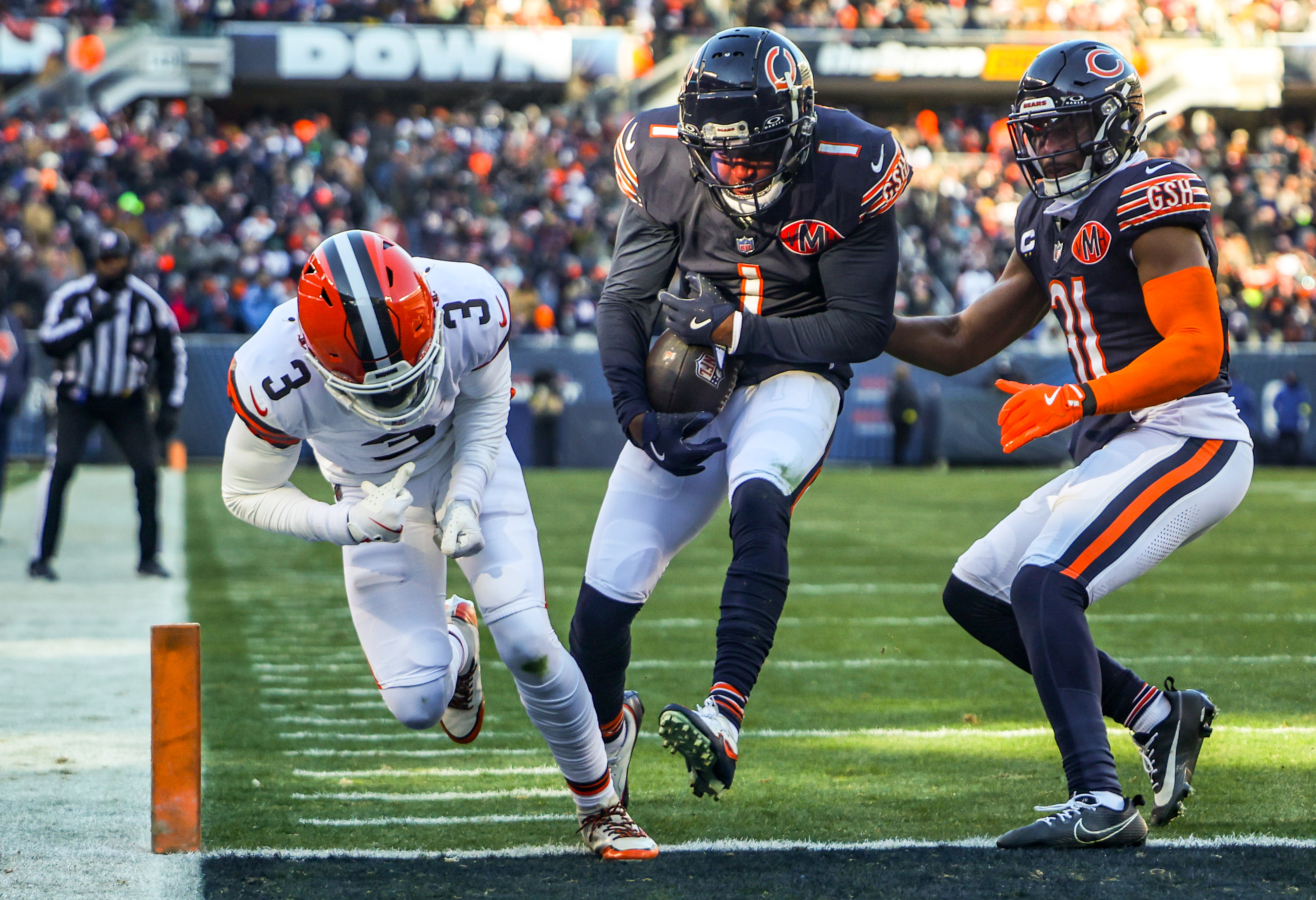 Chicago Bears defensive back Jaylon Johnson (1) makes an interception after it was bobbled by Cleveland Browns wide receiver Jerry Jeudy (3) during the third quarter, Sunday, Dec. 14, 2025, at Soldier Field in Chicago. (Dominic Di Palermo/Chicago Tribune)