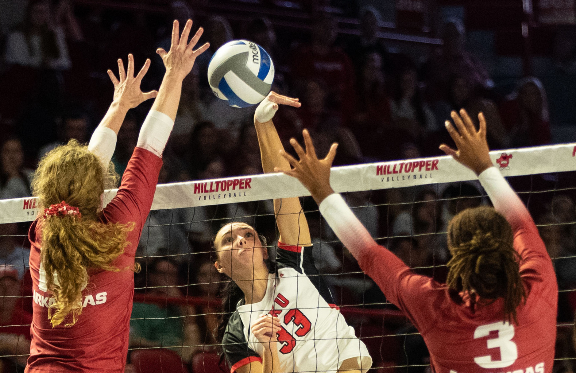 Western Kentucky University right side hitter Kenadee Coyle (33) spikes the ball during a match against University of Arkansas at the E.A Diddle Arena in Bowling Green, Ky. on Wednesday, Sept. 8, 2023. 