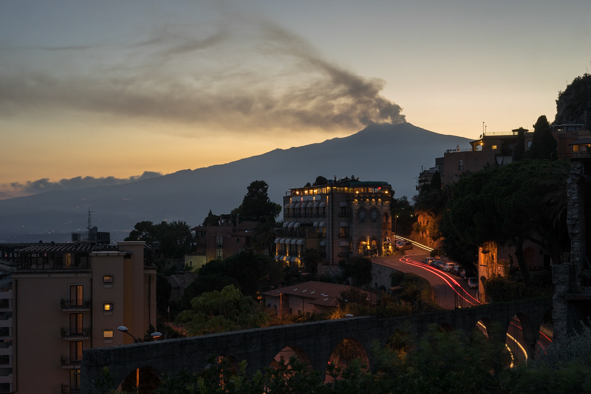 A view from Taormina, when the sun is setting over the vulcano.